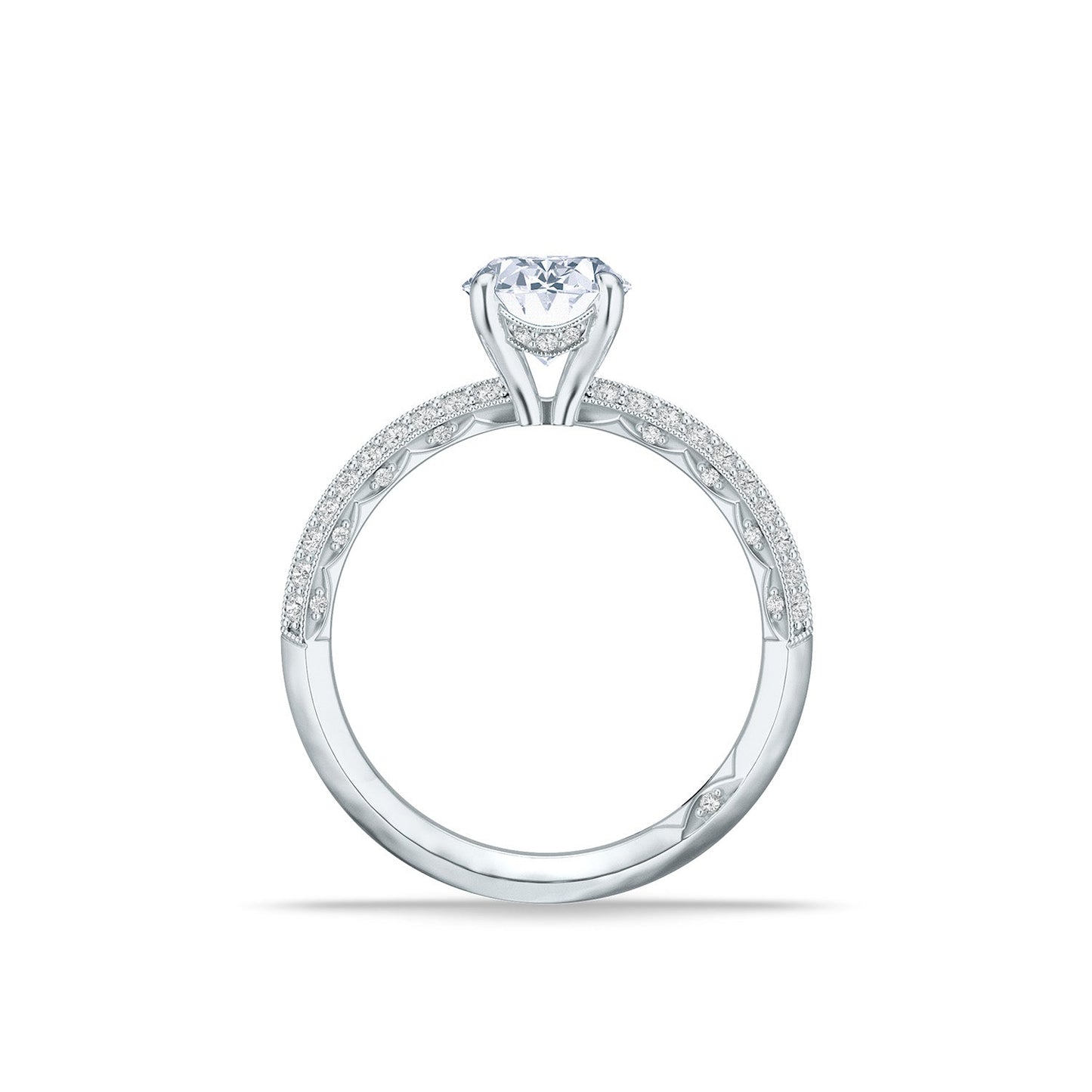 The Tacori Sculpted Crescent 18K White Gold Oval Solitaire Semi Mount Engagement Ring showcases an oval diamond in a six-prong setting. The band is meticulously crafted by Tacori gemologists, featuring intricate detailing and small diamonds encrusted along its sides for an elegant and sparkling design.