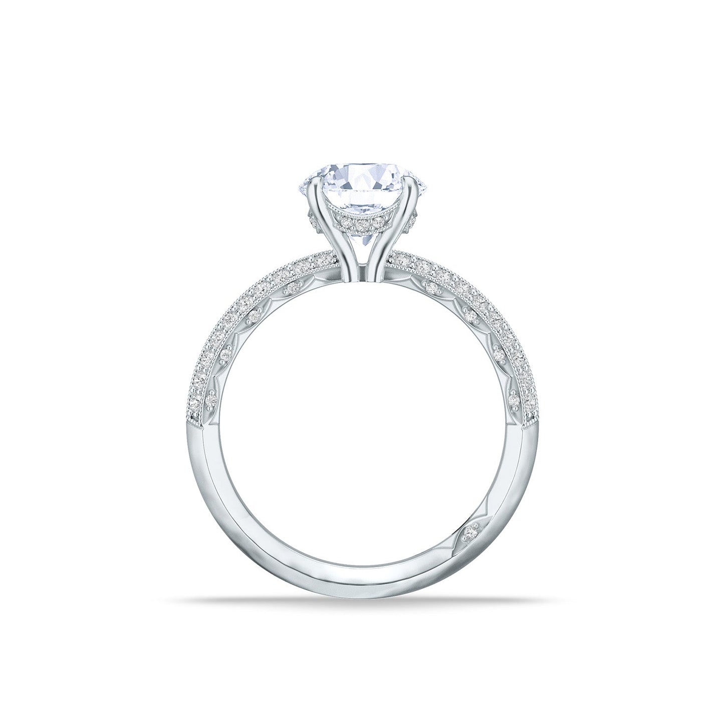 Experience the elegance of the Tacori Sculpted Crescent 18K White Gold Round Brilliant Solitaire Semi Mount Engagement Ring with Diamond Band. Its thin band is adorned with intricate embellishments, adding grace and sparkle, all expertly crafted by Tacori gemologists. It shines beautifully against a plain white background.