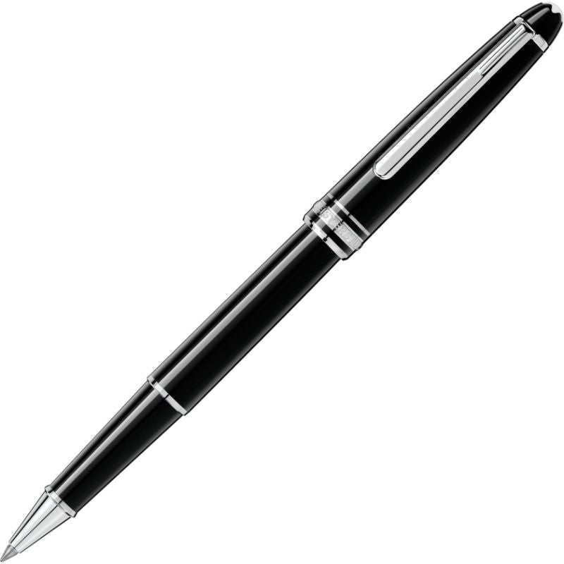 A Montblanc Meisterstuck Classique Rollerball Pen, featuring a sleek black body with silver accents and a glossy finish, is elegantly designed with a shiny metal clip, pointed nib, and decorative silver bands near the cap. This luxury pen is positioned diagonally on a white background.