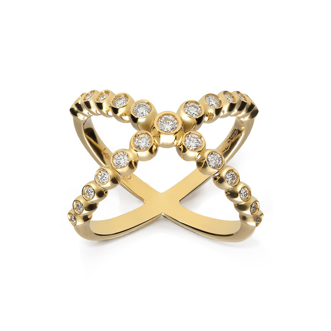 The Leo Pizzo Bubble Collection ring features an X-shaped design crafted in 18K yellow gold with two intersecting bands adorned with natural diamonds, each set in circular bezels, offering a stylish and elegant appearance.