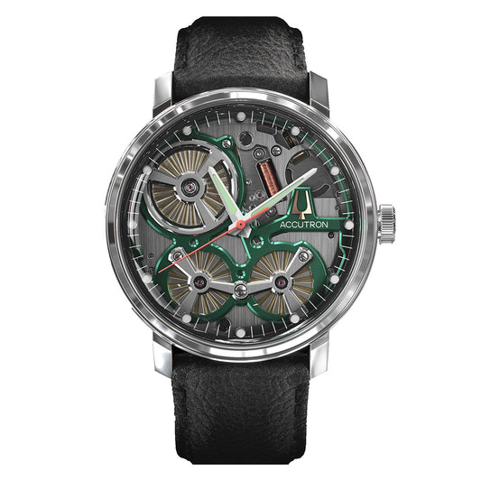 A detailed view of a luxury wristwatch showcases an open-face dial with visible gears and mechanical components. The Accutron Spaceview 2020 Electrostatic 43.5mm Watch features a black leather strap and a stainless steel case, with the Accutron brand name prominently displayed on the dial, emphasizing its electrostatic movement innovation.