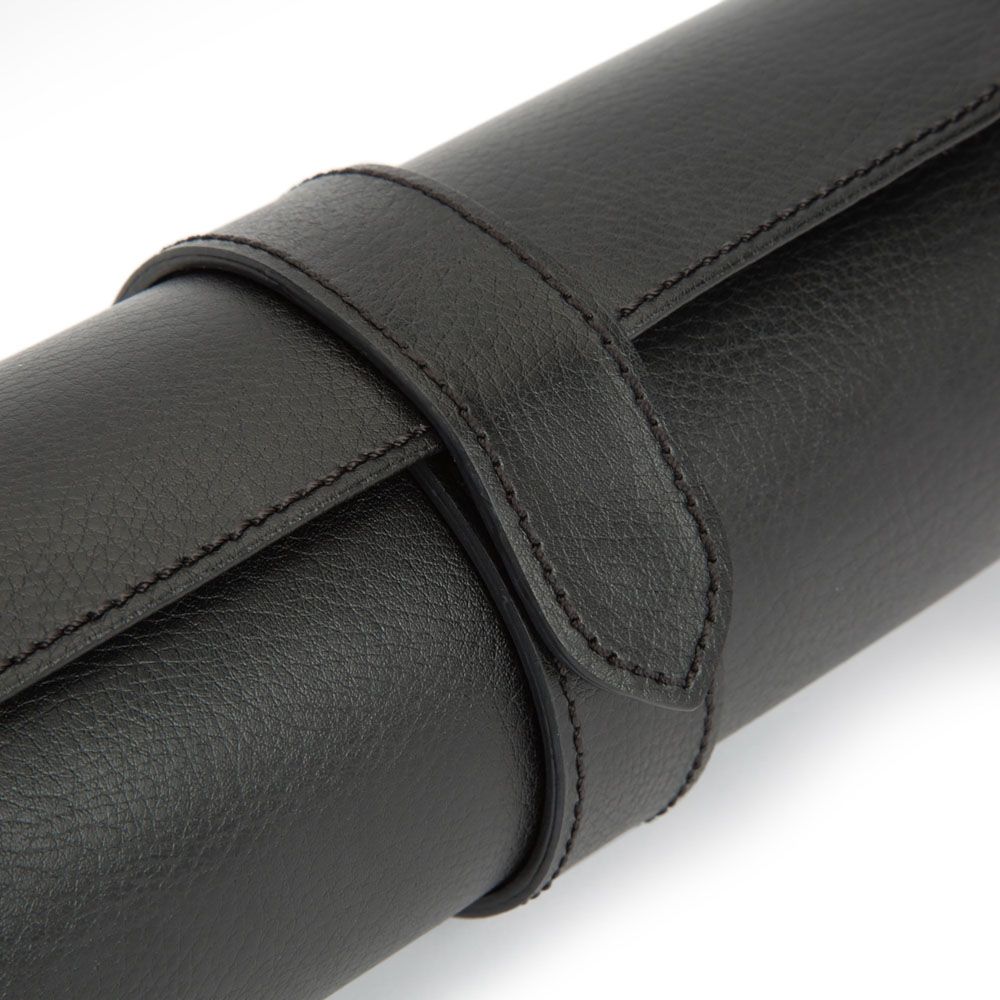 A close-up of the WOLF 1834 Watch Roll Blake With Capsule Black/Grey, highlighting its luxurious black leather crafted by WOLF, with stitched detailing and a secure strap, set against a white background. This handcrafted watch roll perfectly combines elegance and functionality.