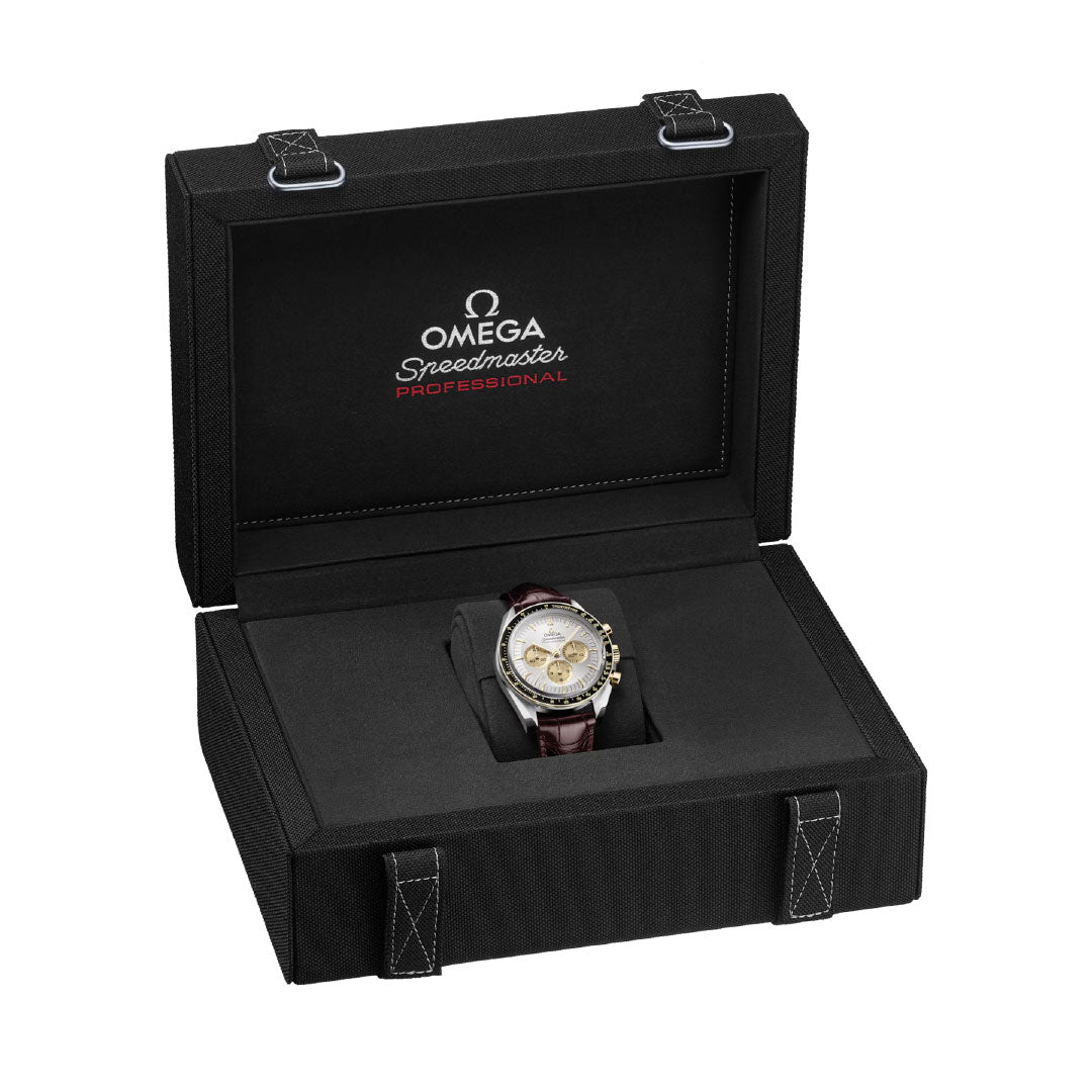The OMEGA Speedmaster Moonwatch Professional Co-Axial Master Chronometer Chronograph 42mm Watch features a brown strap and is presented in an open black box with the OMEGA logo and "Speedmaster Professional" inside the lid.