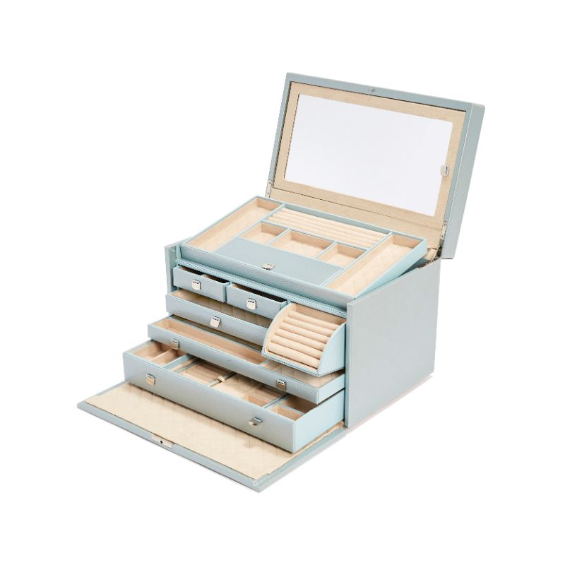 The WOLF 1834 London Large Jewellery Box by WOLF is a chic organizer made from lizard embossed leather, featuring various compartments such as necklace hooks, ring slots, and smaller boxes for earrings. It includes several drawers and an integrated mirror in the lid. Additionally, it is equipped with LusterLocâ„¢ technology to maintain the pristine condition of your jewels.