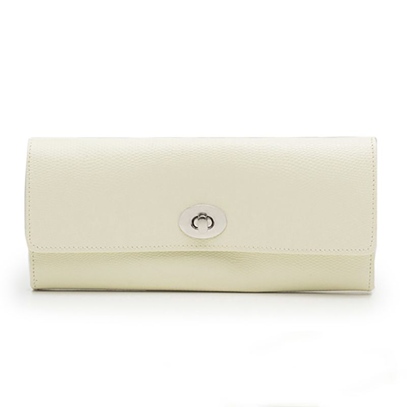 A WOLF 1834 London Jewellery Roll in beige leather featuring a textured, lizard-embossed surface and a silver clasp on the front. This accessory showcases a rectangular shape and minimalist design, elegantly positioned upright against a white background.
