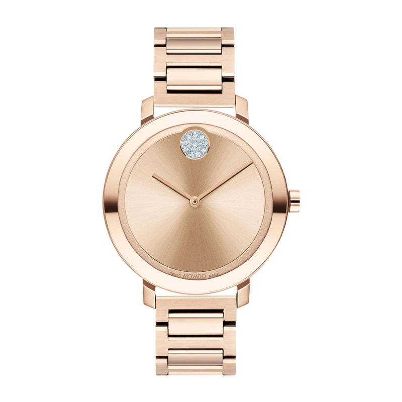 The Movado BOLD Evolution Quartz 34mm Watch by Movado features an elegant, minimalist design in exquisite rose gold. Its round face, accented by a single diamond at the 12 o'clock position, harmonizes beautifully with the coordinating rose gold metal band, making it a classic accessory that radiates sophistication.