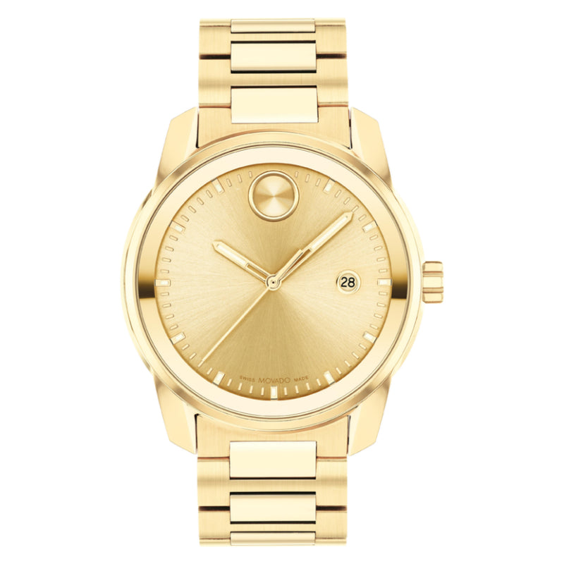 The Movado BOLD Verso Quartz 42mm Watch is a yellow gold wristwatch with a minimalist design and metallic band, featuring a round face. It includes simple hour and minute hands enhanced by Swiss Super-LumiNova, along with a small date indicator and a gold-tone circular detail near the 12 o'clock position.
