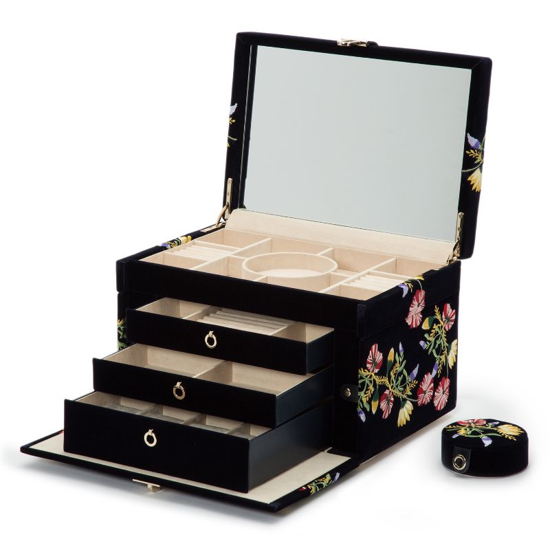 The WOLF 1834 Zoe Large Jewellery Box by WOLF, featuring a mink velvet exterior adorned with black floral patterns, opens to unveil a mirror and beige compartments. It includes three drawers that pull out for additional jewelry storage, complete with the LusterLocâ„¢ interior. A small matching round box accompanies this elegant set.