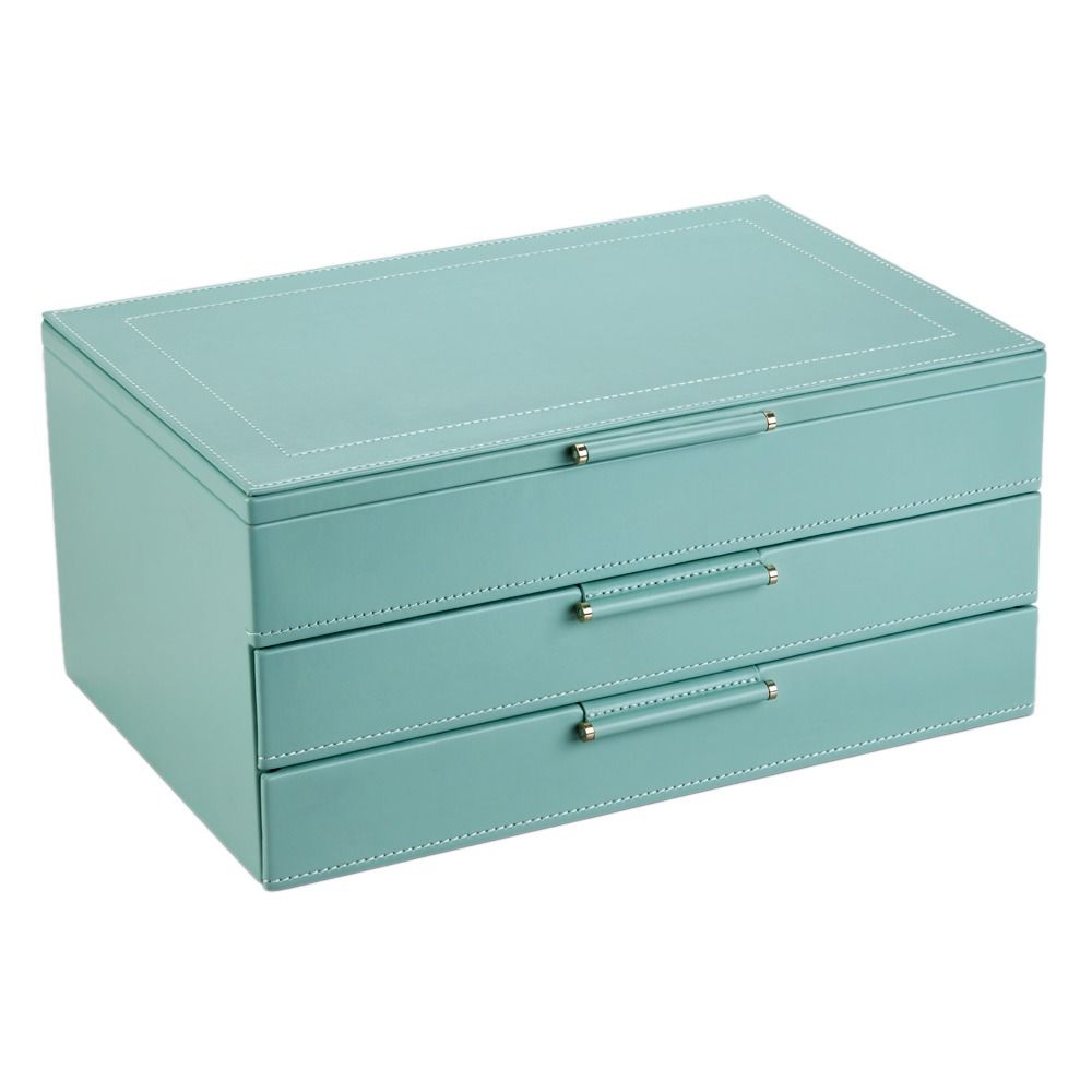 The WOLF 1834 X Fiona Howard Sophia Jewellery Box With Drawers Jade Fruit Botanical Style Number by WOLF is a rectangular light teal leather jewellery box, featuring three pull-out drawers and white stitching along the edges. The box has an anti-tarnish lining to protect your valuables and is shown closed on a plain white background.
