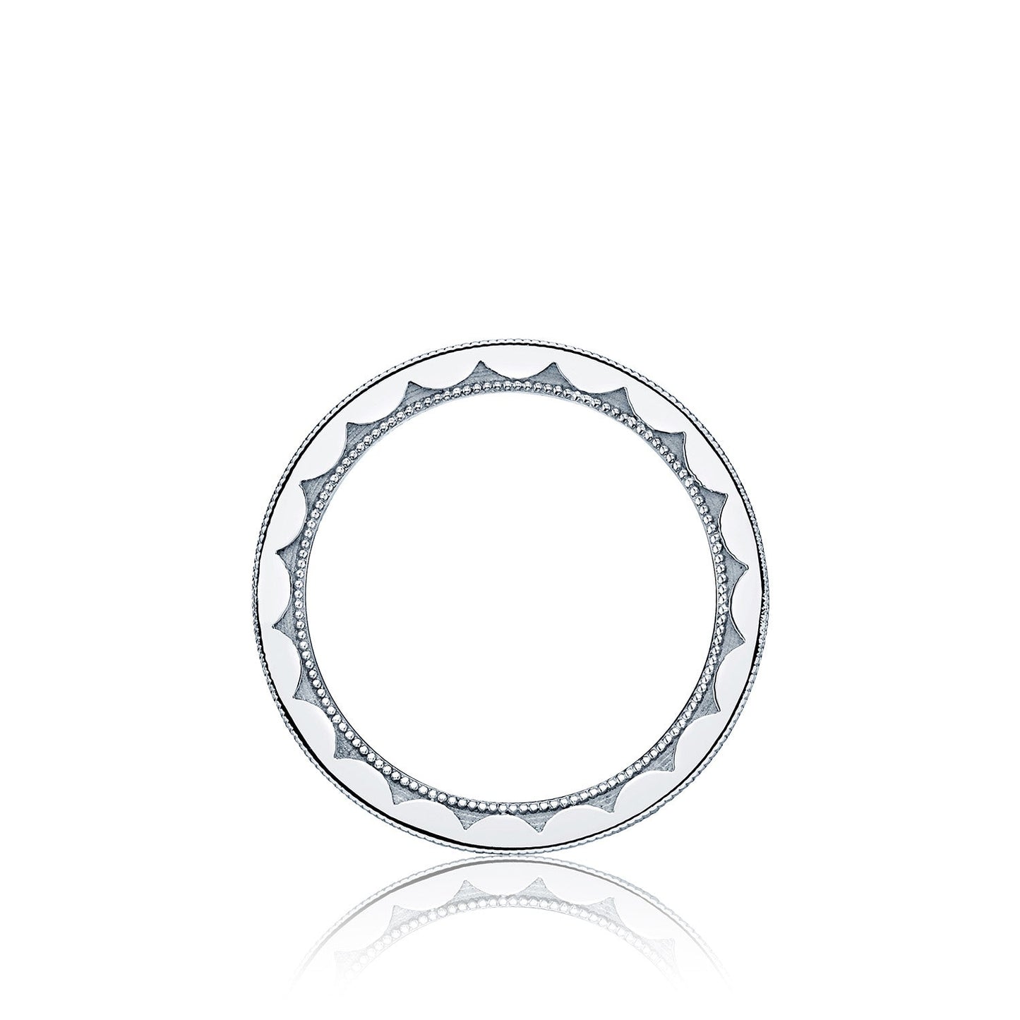 Discover the Tacori Sculpted Crescent 18K White Gold Channel Set Round Brilliant Diamond Eternity Ring, featuring a symmetrical and elegant design reminiscent of a decorative plate with circular patterns around the rim. The ring showcases alternating triangular shapes and dotted accents, echoing a gemologist's precision, set against a plain white gold background for timeless appeal.