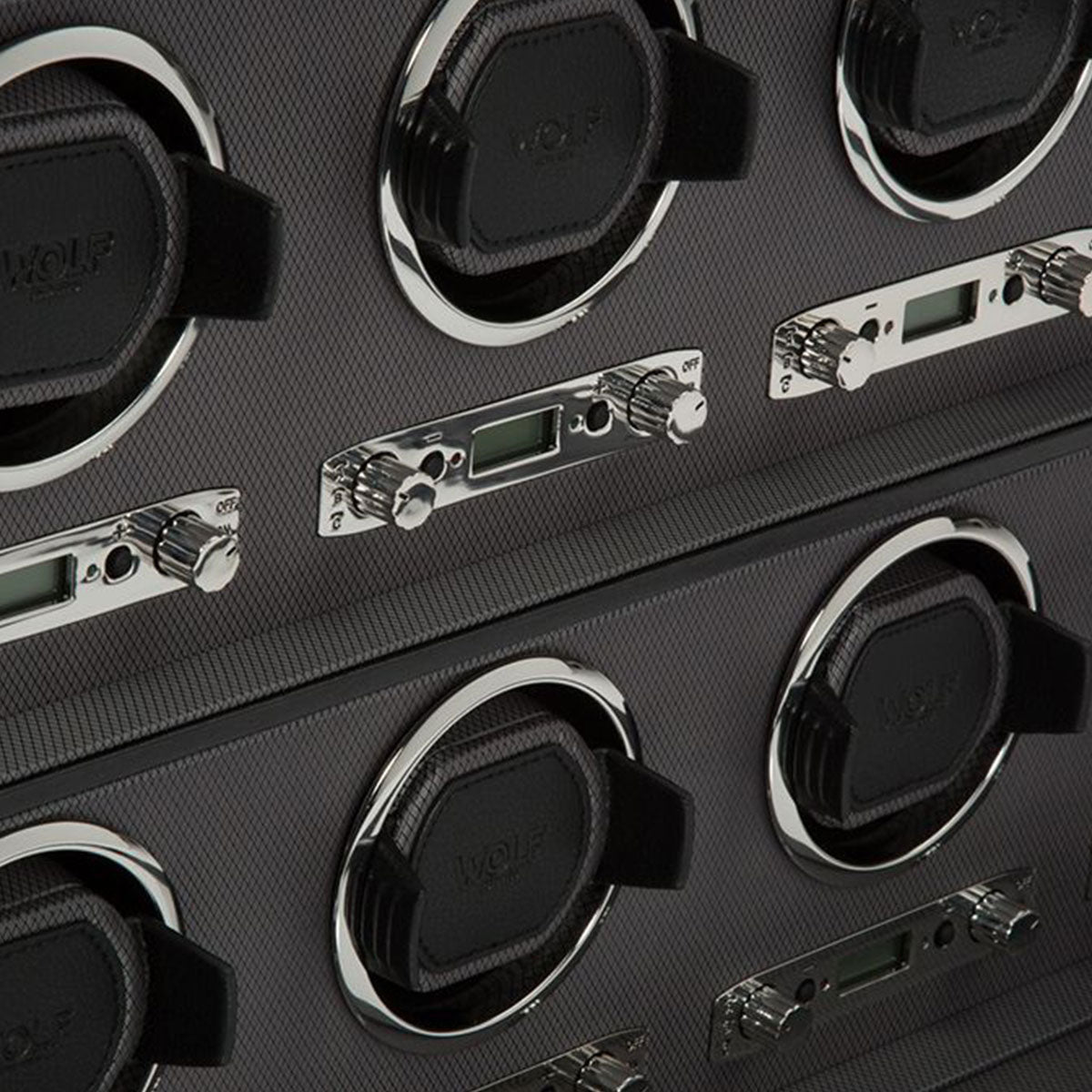 The WOLF 1834 Viceroy Black 8 PCS Watch Winder exemplifies timeless elegance with its sleek carbon fiber texture and chrome accents. It includes multiple slots for watches along with small control panels featuring knobs and digital displays to ensure precise maintenance of your timepieces.