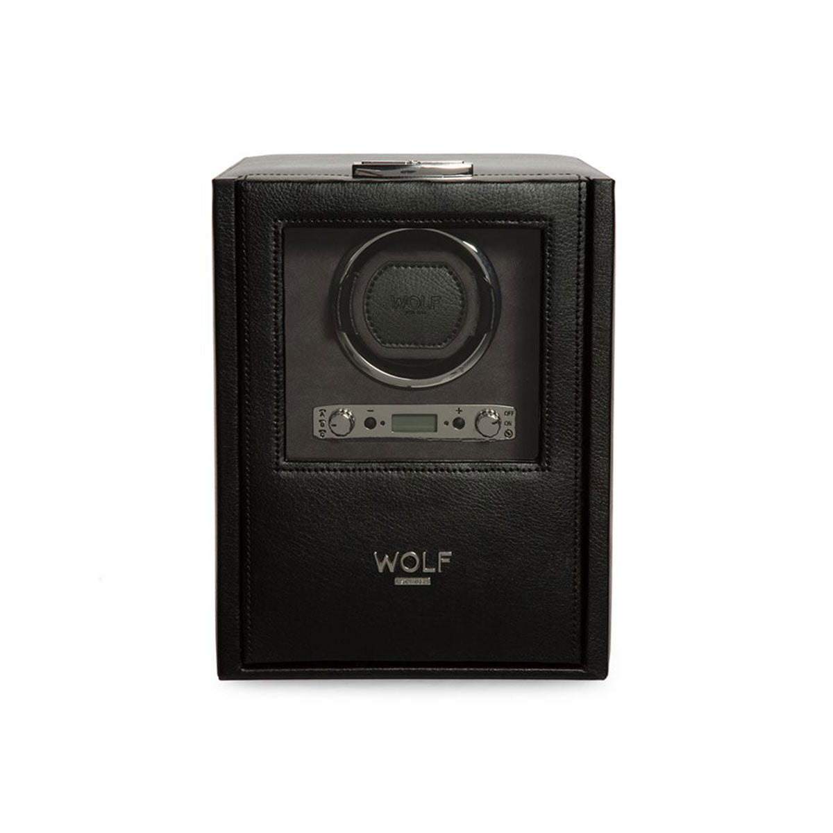 The WOLF 1834 Blake Single Watch Winder with Storage, crafted in black leather, boasts a transparent cover that reveals a circular slot for a watch. It includes a digital display and control buttons located below the slot, providing directional settings and rotation options. The brand name "WOLF" is prominently displayed on the front.