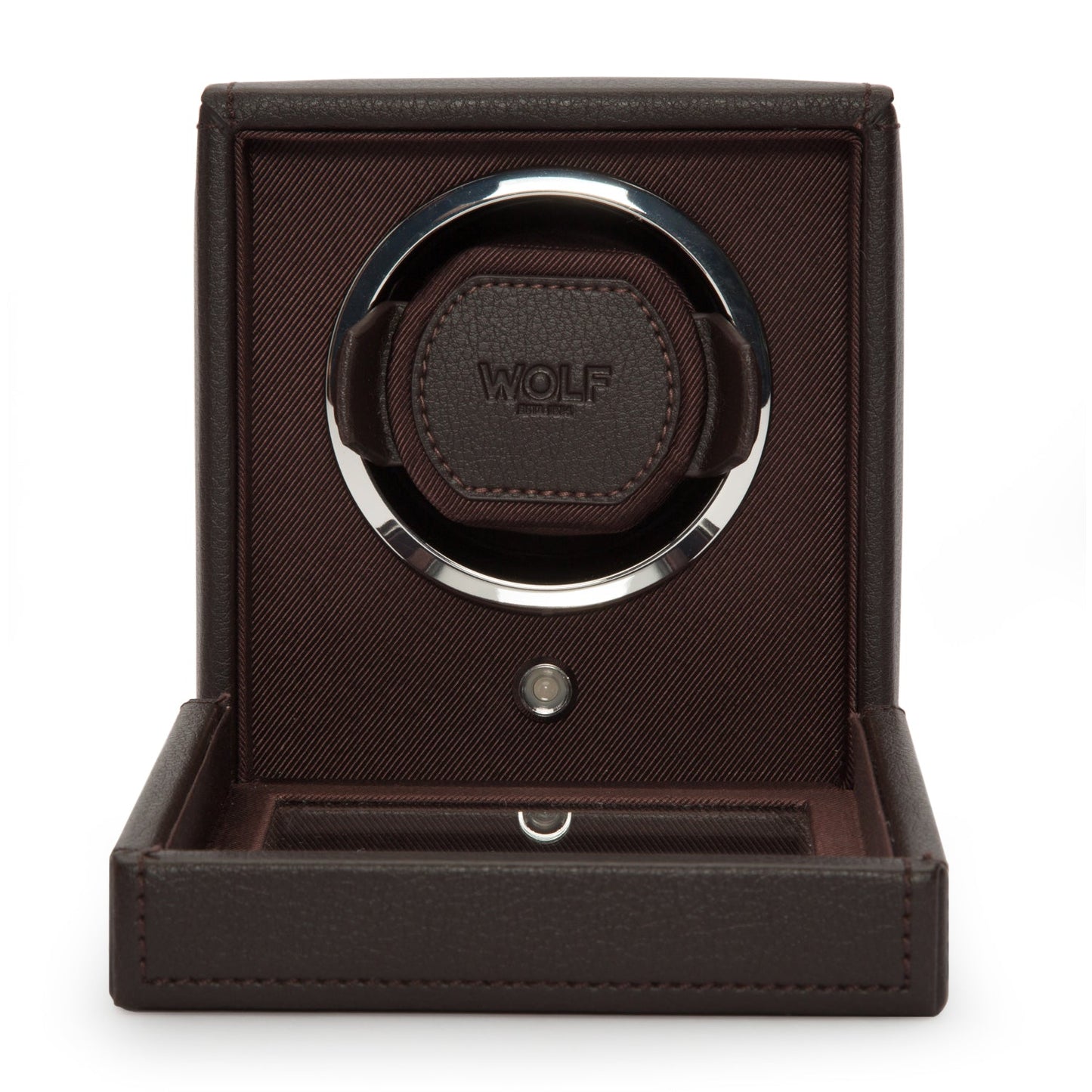Introducing the WOLF 1834 Cub Single Watch Winder With Cover, a sophisticated piece crafted by the renowned brand WOLF. This watch winder utilizes patented rotation technology and is encased in a sleek and elegant dark brown vegan leather, creating a minimalist yet refined aesthetic.