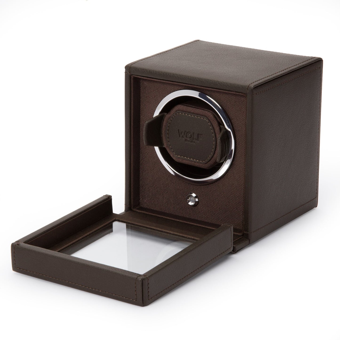 The WOLF 1834 Cub Single Watch Winder With Cover, crafted by WOLF, showcases a sleek rectangular design in brown vegan leather and features an open glass door that reveals its patented rotation mechanism.