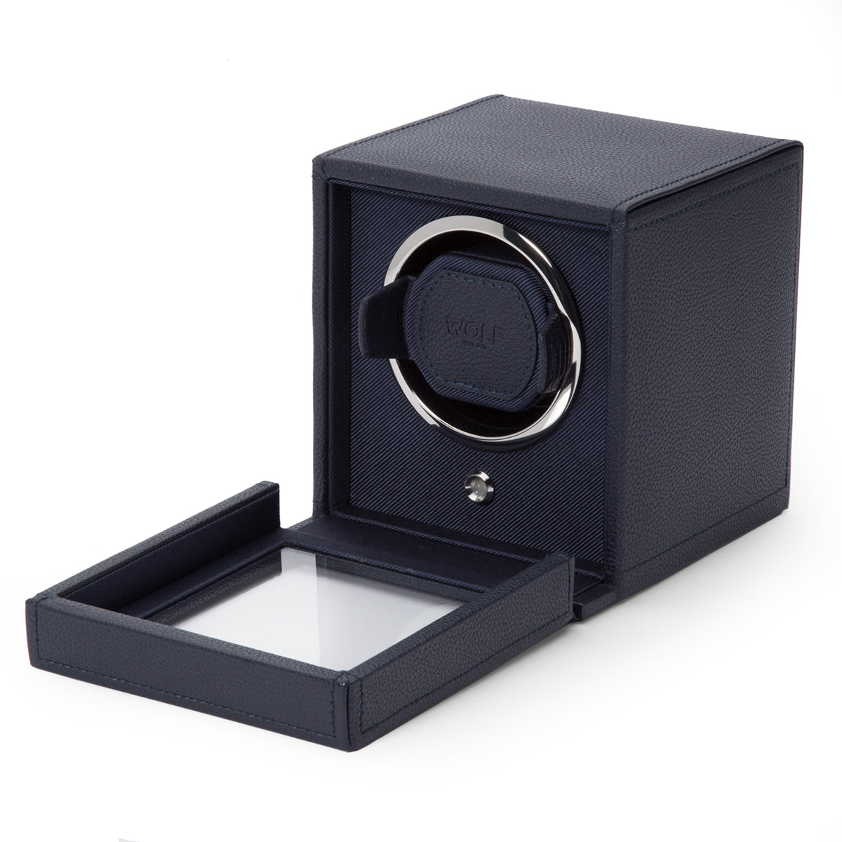 Introducing the WOLF 1834 Cub Single Watch Winder With Cover, a sophisticated dark blue accessory featuring a sleek, textured exterior made from vegan leather. The design includes an open front panel that reveals ample space for your watch, while its transparent lid highlights WOLF's patented innovation and provides a clear view inside.