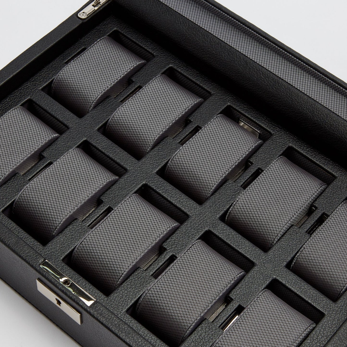 The WOLF 1834 10 Piece Watch Box by WOLF is a black storage case with a grid layout that includes ten empty slots, each lined with gray textured vegan leather. Designed for holding individual watches or accessories, it is displayed from a top angle.