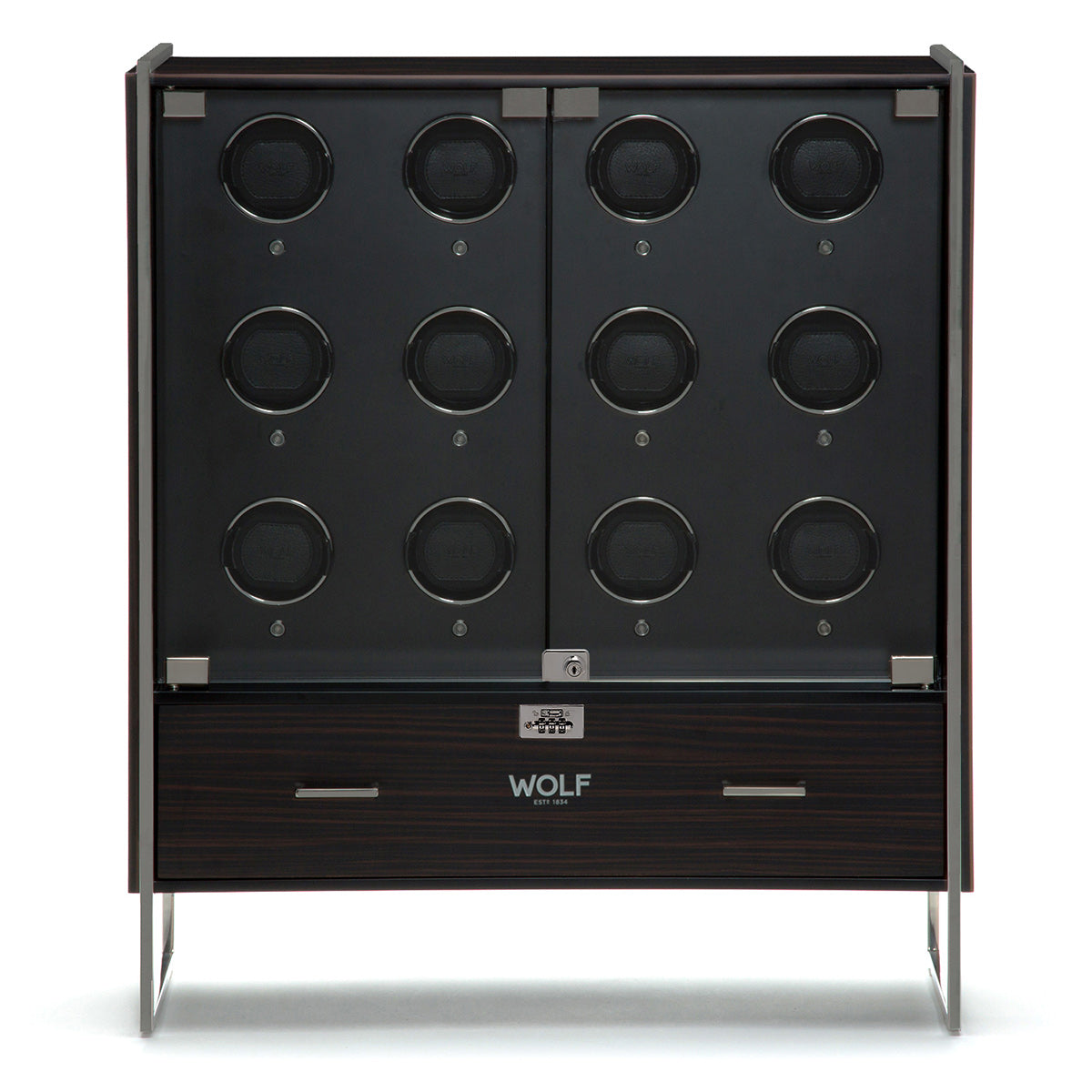 Introducing the WOLF 1834 Regent 12 Piece Cabinet Winder, a contemporary luxury watch cabinet featuring dark wood finish and sleek metal accents. It boasts two symmetrical rows of round compartments behind a glass door, accompanied by a drawer below. The brand name "WOLF" is prominently displayed on the front. Enjoy the convenience of Bluetooth app-controlled settings.