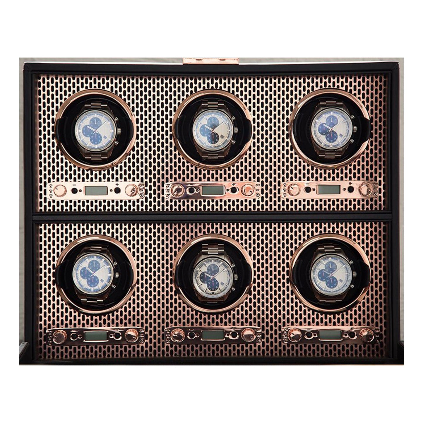 The WOLF 1834 Axis 6 Piece Winder, by the renowned brand WOLF, showcases six luxury watches, each nestled in its own circular compartment with a metallic mesh background and a gleaming copper finish. These watches feature intricate luxury designs with dials enclosed in a sleek, rectangular frame.
