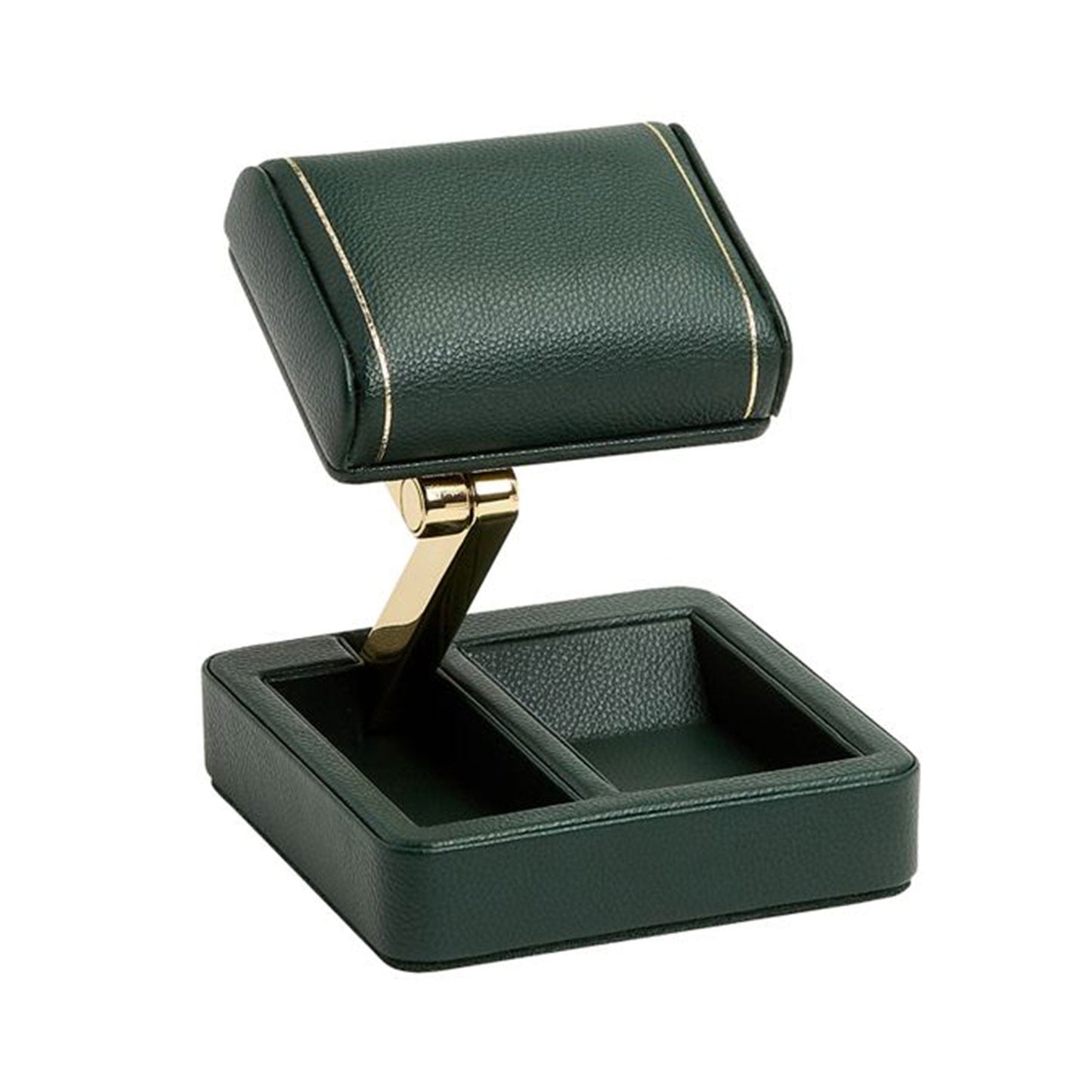 Introducing the WOLF 1834 British Racing Single Travel Watch Stand, a sleek vegan leather accessory in dark green with elegant gold accents. Its upper compartment is open and angled, featuring two distinct base sections and a patented folding mechanism for convenient storage.