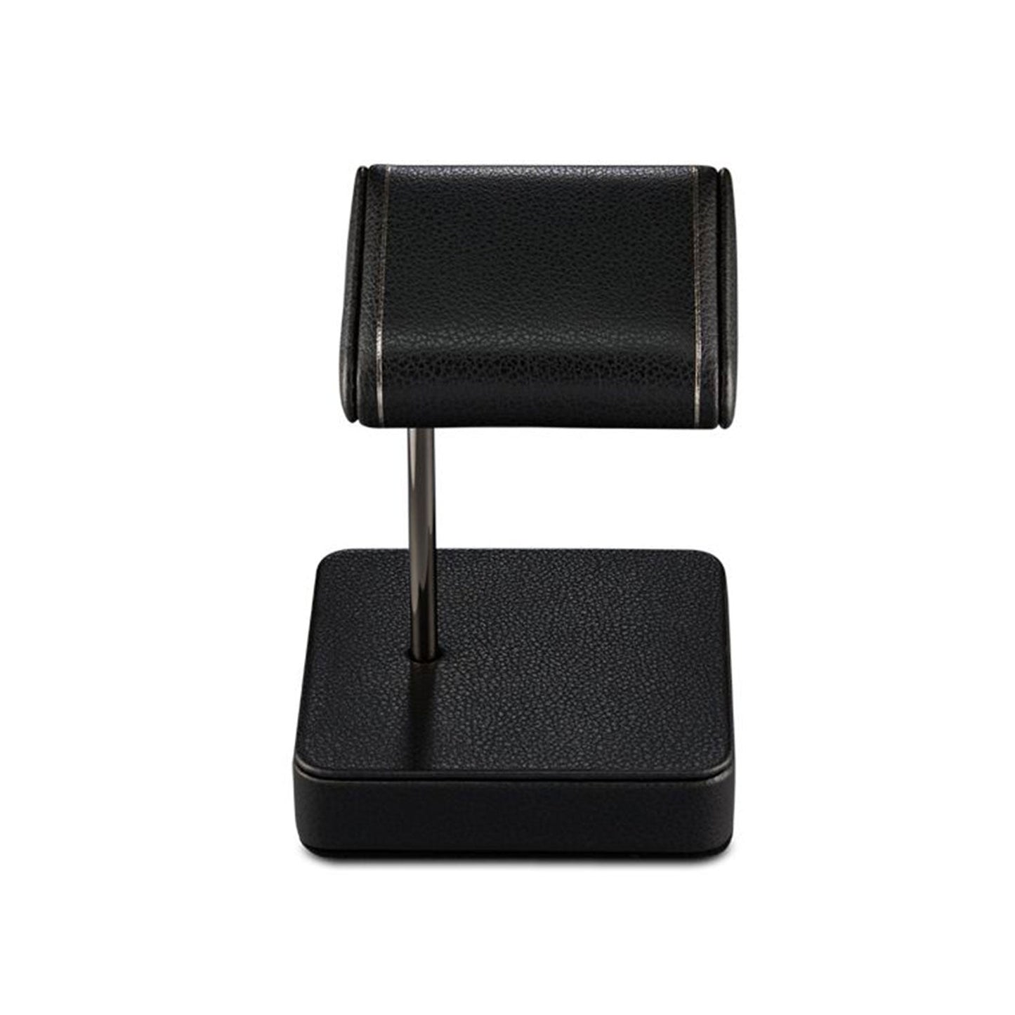 The WOLF 1834 British Racing Single Static Watch Stand by WOLF is an elegant black display piece with a textured vegan leather surface. It features a cylindrical rest supported by a vertical rod attached to a square base, making it perfect for showcasing your favorite watch or bracelet with sophistication.