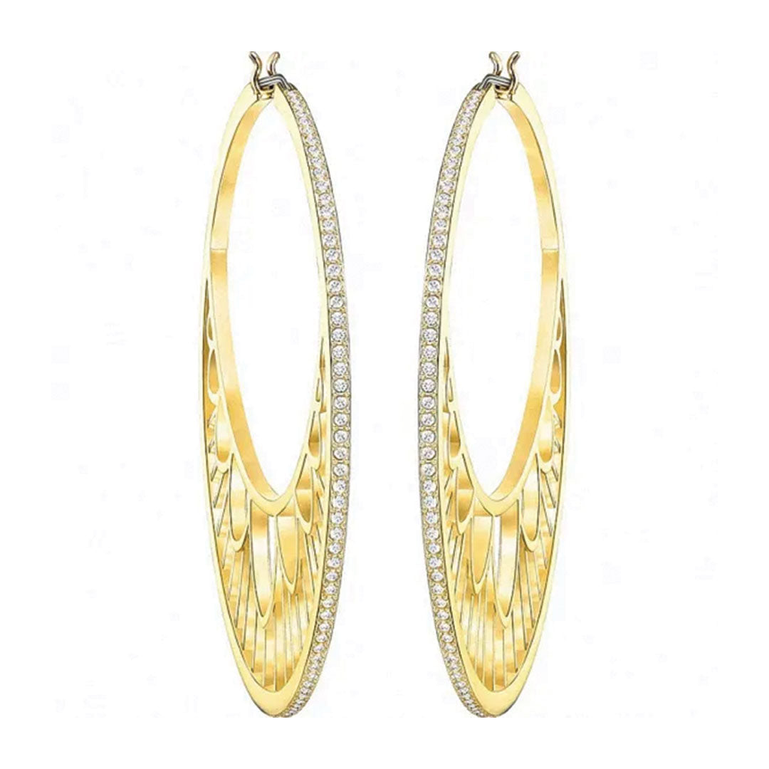 The Swarovski Georgette Hoop Earrings are an elegant and elongated pair of gold hoops designed with intricate cut-out patterns and adorned with a row of small, sparkling Swarovski crystals along the outer edge.