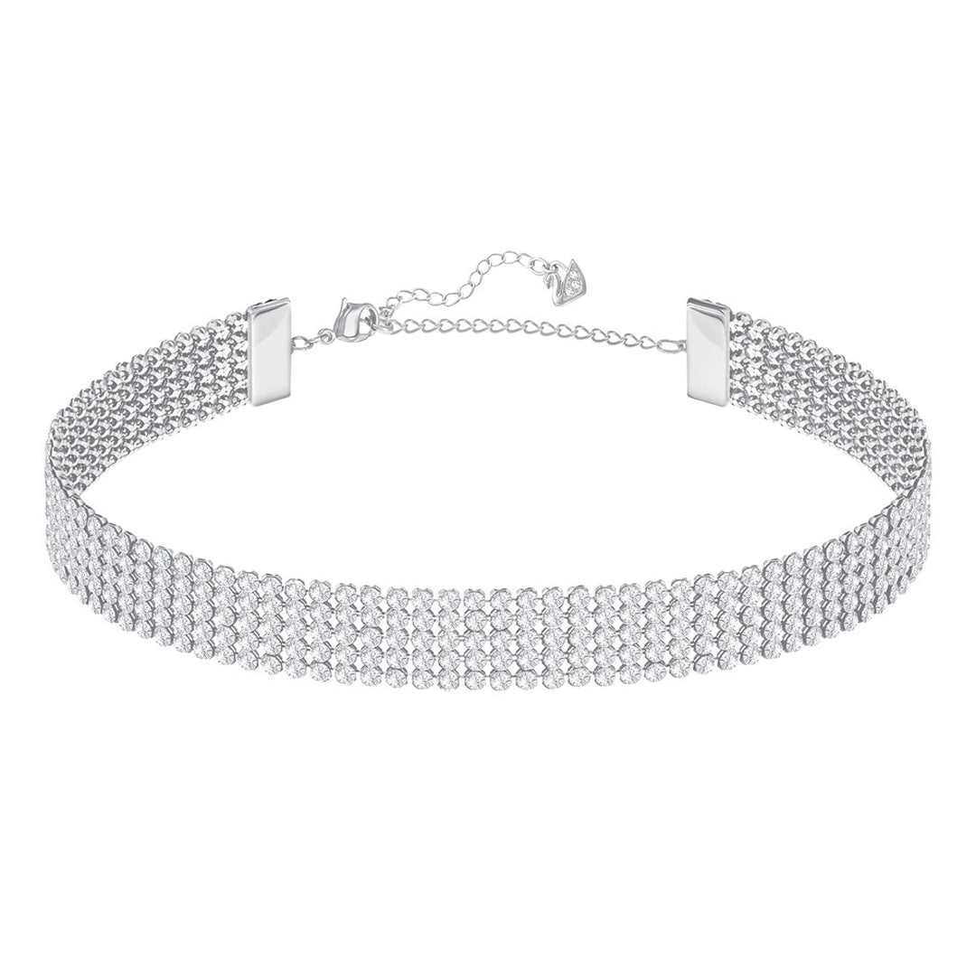 The Swarovski Fit Choker, from the brand Swarovski, captivates with several rows of tiny white crystals set on a shimmering silver background. It is beautifully enhanced with palladium plating and includes an adjustable chain and clasp to ensure a perfect fit.