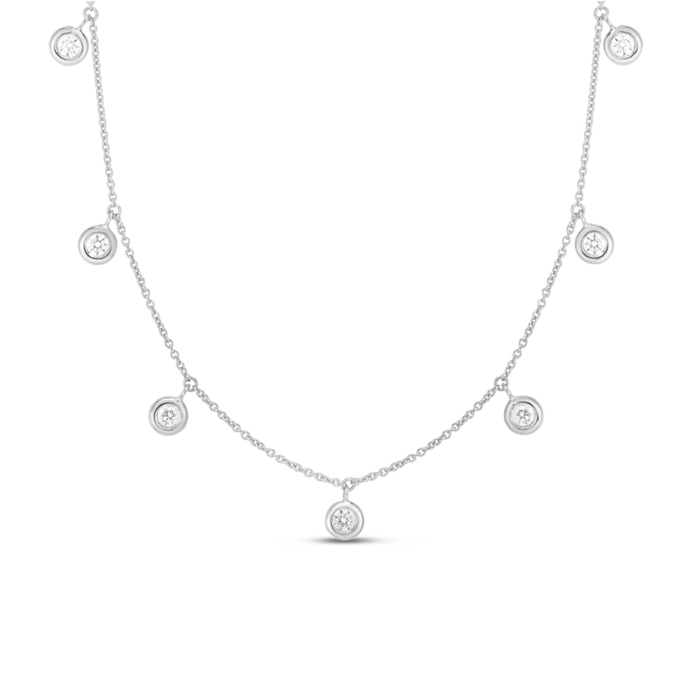 The Roberto Coin Diamonds By The Inch 18K White Gold Dangling Seven Station Necklace is a delicate piece featuring sparkling gems nestled in small round pendants, evenly spaced along the chain. It perfectly embodies the elegance of Roberto Coin's distinguished collection.