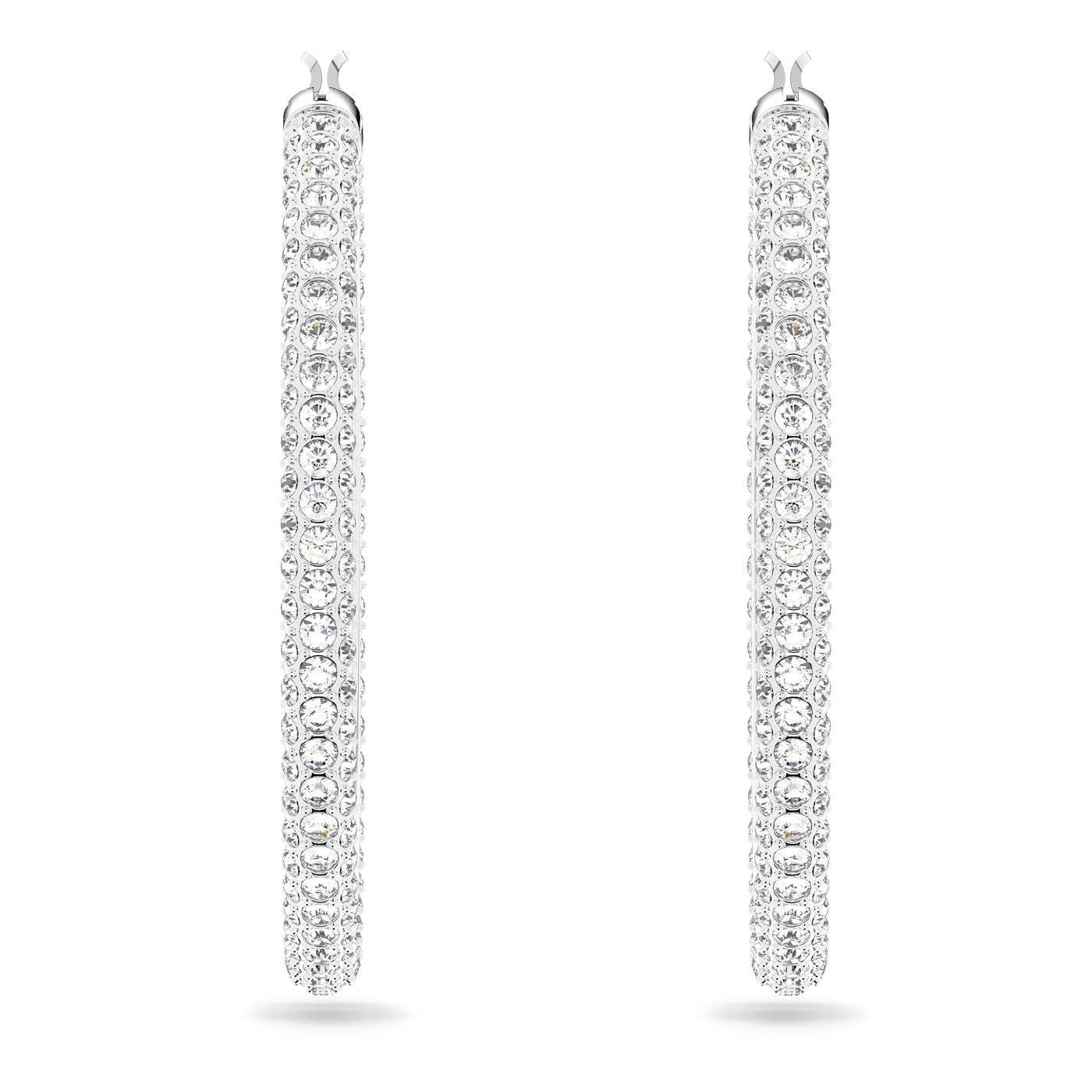 The Swarovski Pave Stone Hoop Earrings captivate with their long, silver hoops adorned with rows of radiant, round gemstones and brilliant Swarovski elements, creating a mesmerizing shimmer. These rhodium-plated pieces are showcased vertically against a simple white backdrop.