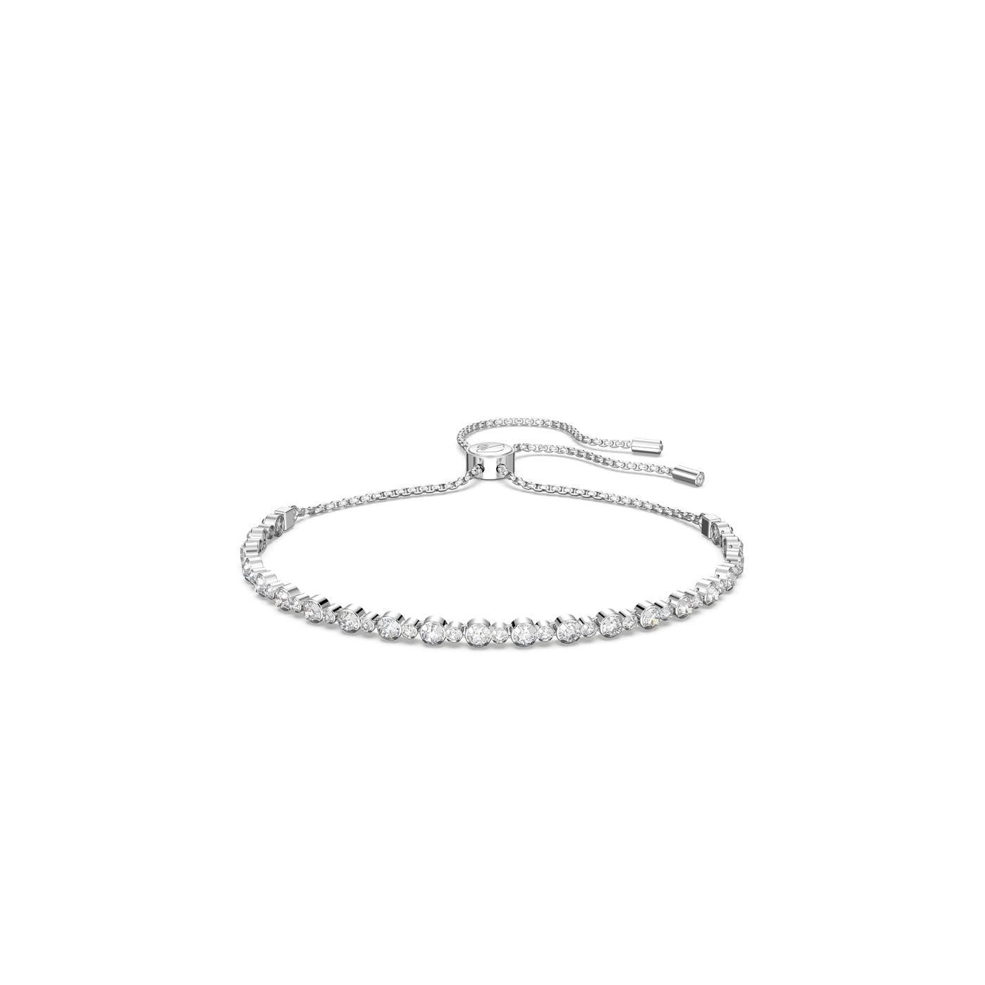 The Swarovski Subtle Round Cut Trilogy Bracelet is a delicate silver cupchain bracelet, embellished with a series of sparkling white stones set in a line. It boasts an adjustable sliding closure with two clasps for a customizable fit, offering a design that is both minimalistic and elegant.