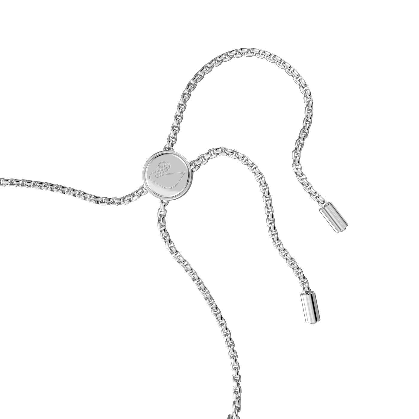 The Swarovski Subtle Round Cut Trilogy Bracelet features a silver adjustable chain and includes a round slider adorned with a subtle logo in the center. Its cupchain bracelet design is completed with two dangling ends capped with cylindrical shapes, set against a plain white background.
