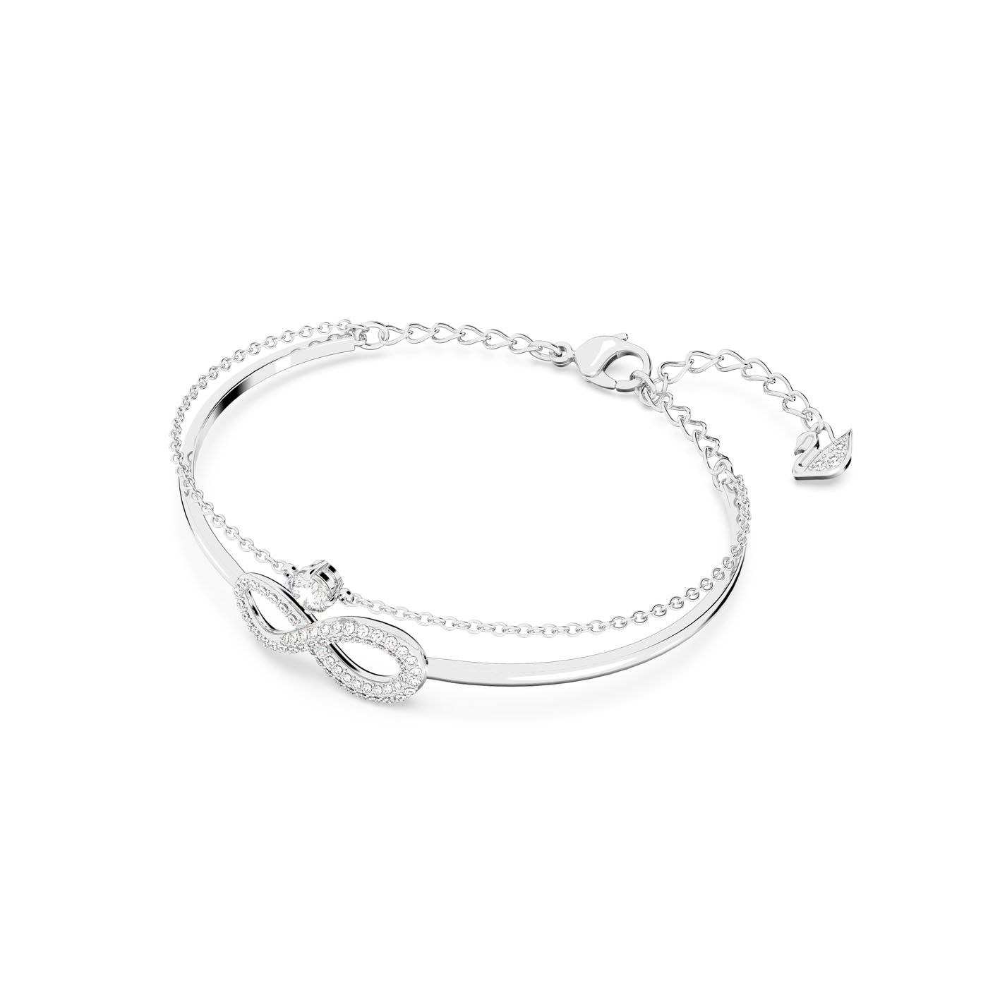 The Swarovski Infinity Bangle is a beautiful silver bracelet adorned with an infinity symbol encrusted with sparkling Swarovski crystals, enhanced by rhodium plating. It features an adjustable chain and is secured with a lobster clasp closure, elegantly presented on a white background.