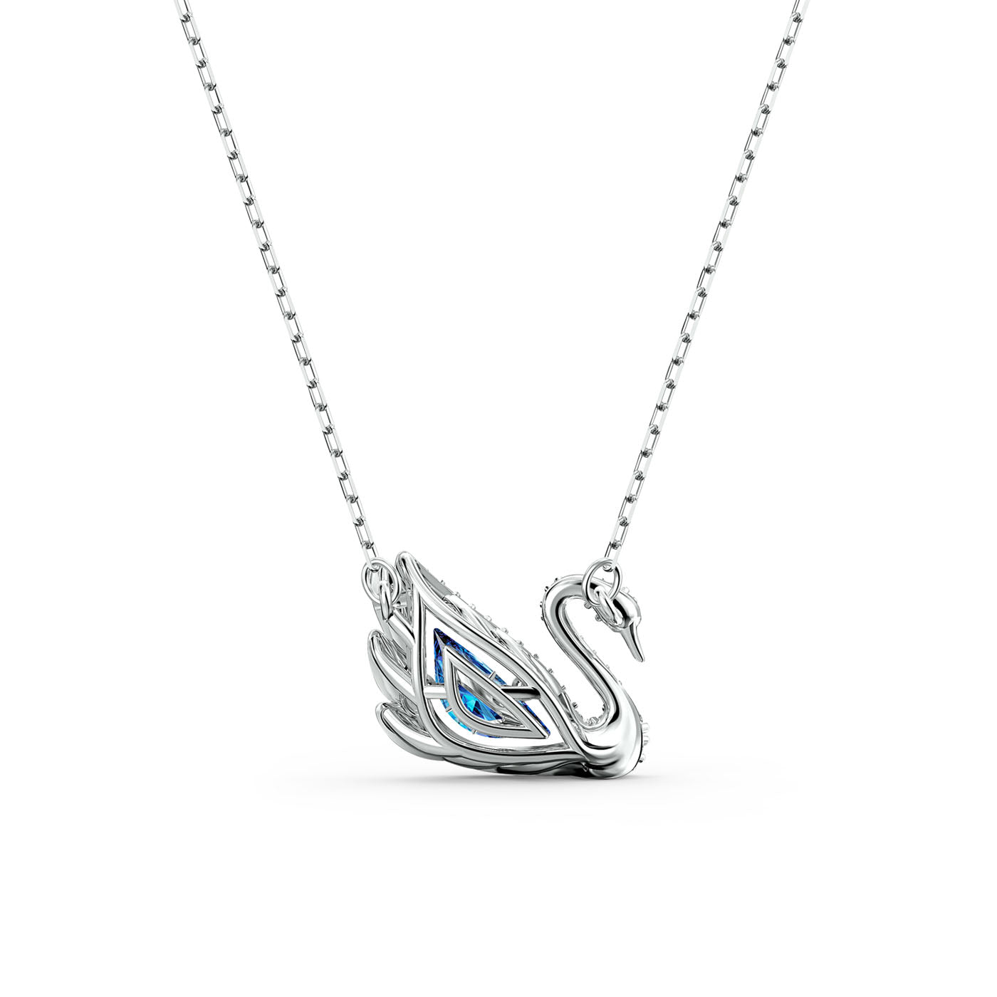 A Swarovski Dancing Swan Necklace Pendant, crafted by the renowned Swarovski brand, features a graceful silver swan design hanging from a fine chain. This elegant piece is enhanced by a blue gemstone nestled in the swan's wing, offering a sophisticated touch of color akin to classic Swarovski jewelry. The plain white background accentuates its refined beauty.