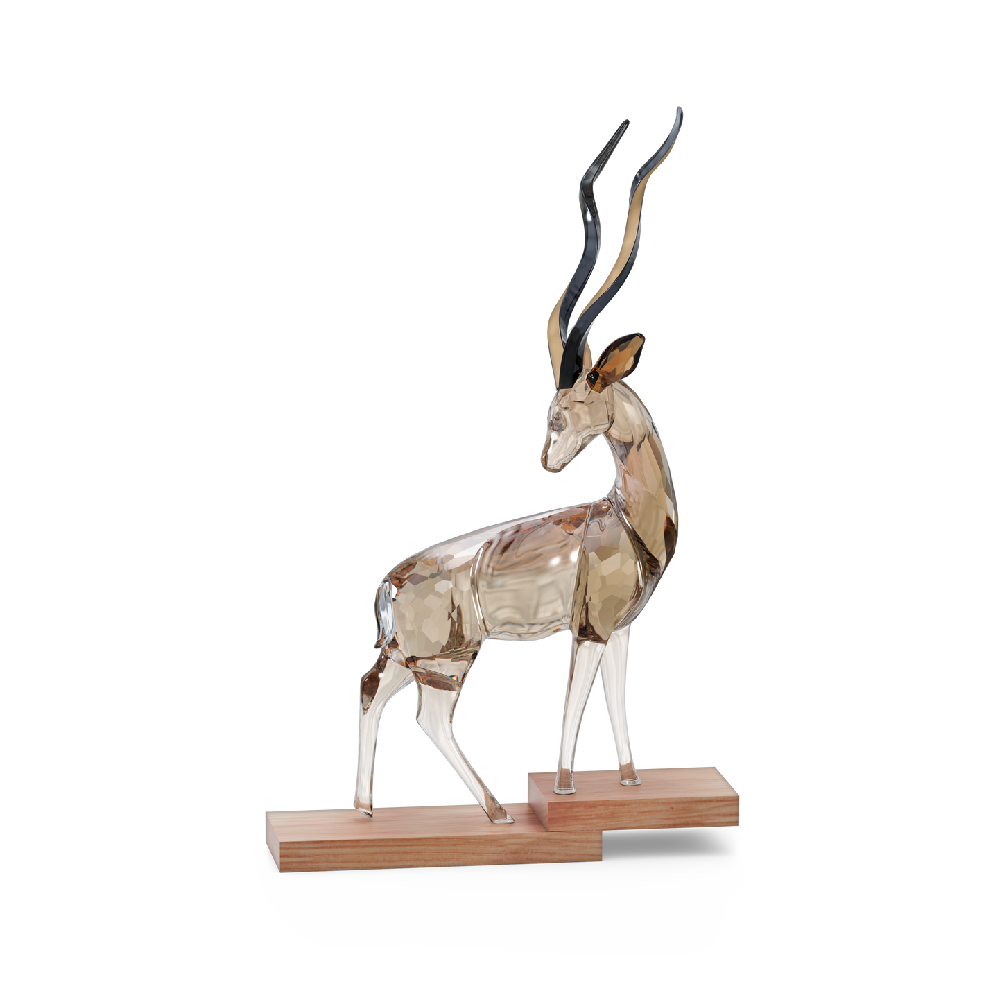 The Swarovski African Sunset Kudu Anya Crystal Home Decor from the Swarovski brand features a glass sculpture of a kudu with long, curved horns set on a wooden base against a white background. This piece is part of the African Sunset collection and is designed with crystal facets that enhance its translucent appearance, highlighting intricate details.