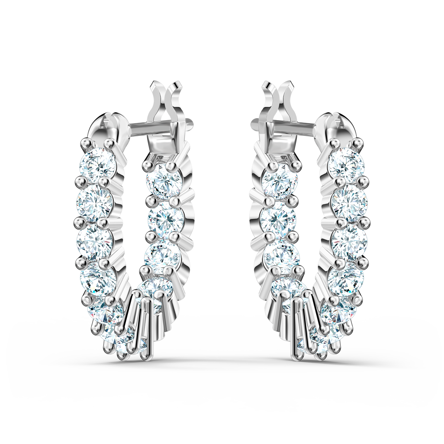 The Swarovski Vittore Hoop Earrings, crafted in silver, feature a stunning array of sparkling white stones set in a linear design. They are elegantly displayed upright against a simple white backdrop.