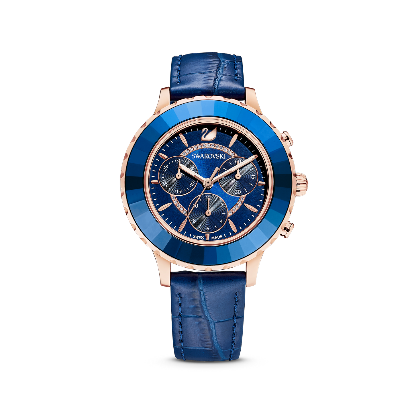 The Octea Lux Chrono watch by Swarovski, Swiss Made with a rose gold-tone finish, features a sophisticated round face with multiple dials and a polished stainless steel case. Its textured blue leather strap complements the watch's elegant design, making it an ideal choice for those who value the precision of Quartz movements.