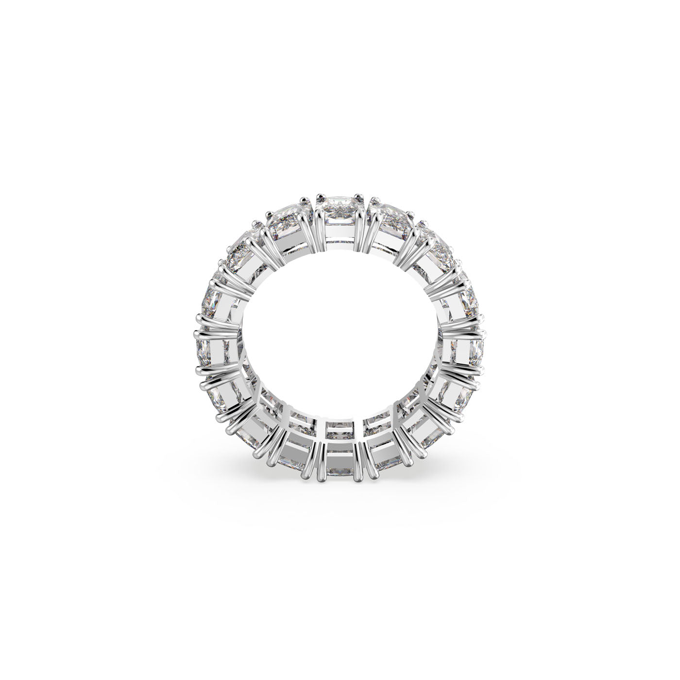 The Swarovski Vittore Rectangular Cut Ring is a stunning piece featuring a series of sparkling, rectangular clear gemstones that encircle the entire band, elegantly set against a plain white background. It's an ideal choice for achieving a stacked ring look.