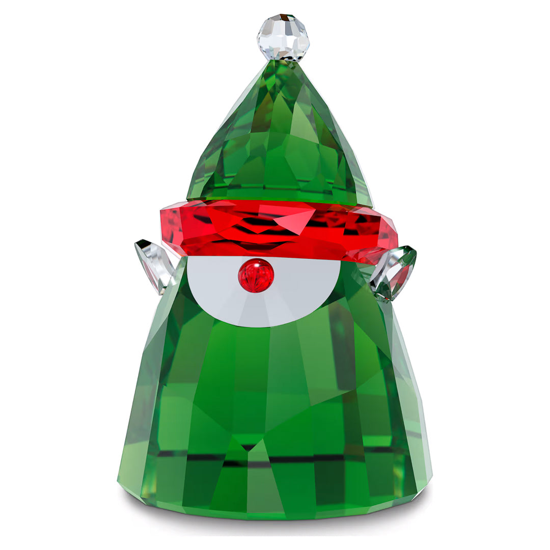 Introducing the Swarovski Holiday Cheers Santa's Elf Home Décor by Swarovski: A captivating green crystal figurine shaped like a gnome, adorned with a pointed hat and featuring a striking red diamond-shaped gem as its face. The faceted body is designed to brilliantly reflect light, while the figure is topped with an elegant small, clear crystal ball. This enchanting elf ornament brings a touch of magic to your holiday décor.