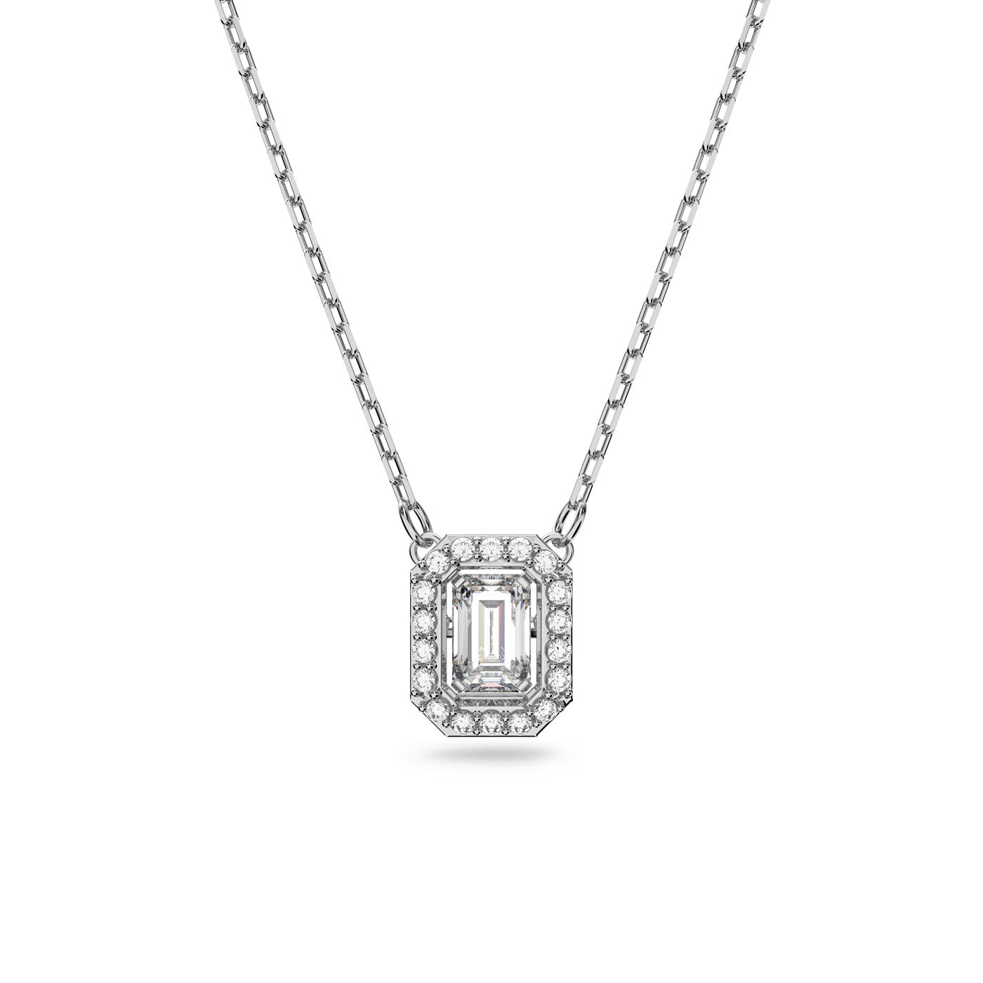 The Swarovski Millenia Octagon Cut Necklace by Swarovski features an octagon-shaped pendant with a central emerald-cut diamond, surrounded by smaller round diamonds. The necklace boasts a delicate, thin link design chain that is rhodium-plated, enhancing the elegant and luxurious appeal of the pendant.