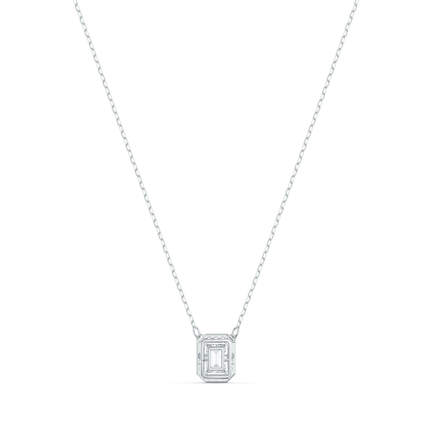 The Swarovski Millenia Octagon Cut Necklace by Swarovski is a delicate piece featuring an emerald-cut gemstone set in an octagonal pendant design. Resting on a thin, rhodium-plated chain, this minimalist necklace embodies both simplicity and sophistication against a plain white background.