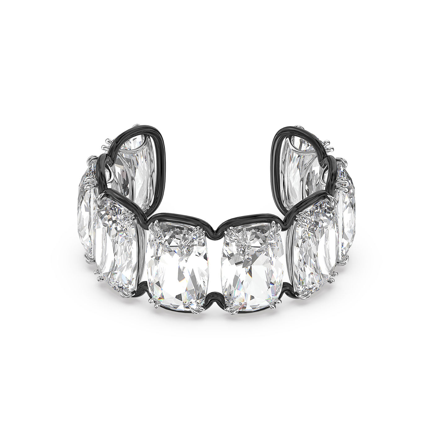 A detailed view of the Swarovski Oversized Floating Crystals Harmonia Cuff by Swarovski, showcasing several large cushion-cut crystals set in a silver band. The crystals exhibit stunning facets and clarity, reflecting light beautifully with the mesmerizing allure characteristic of Swarovski designs.