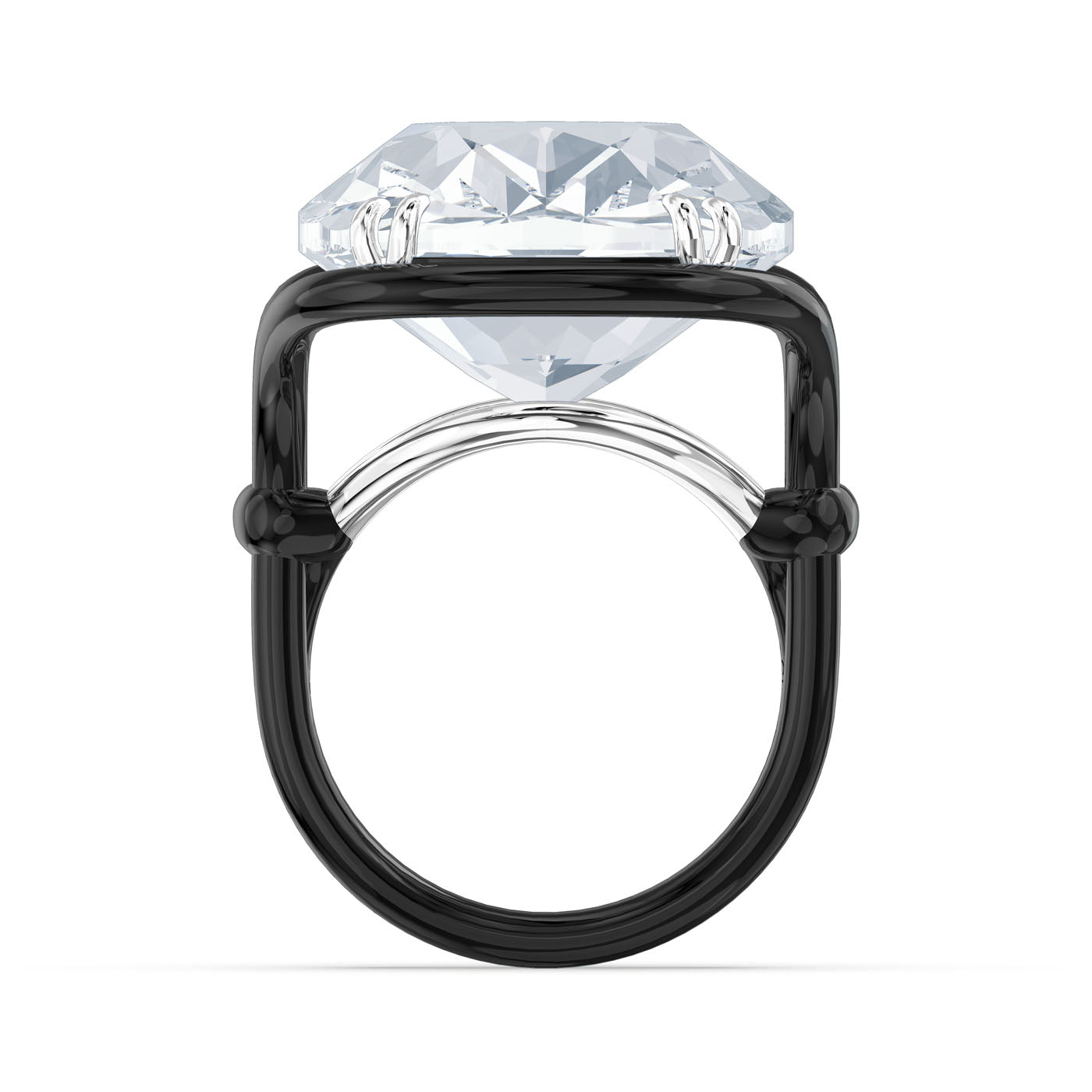 The Swarovski Oversized Crystal Harmonia Cocktail Ring showcases an oversized cushion-cut crystal elegantly set in a sleek black band. This design enhances the gemstone's brilliance and symmetry, offering a striking contrast between the dark frame and the sparkling stone.