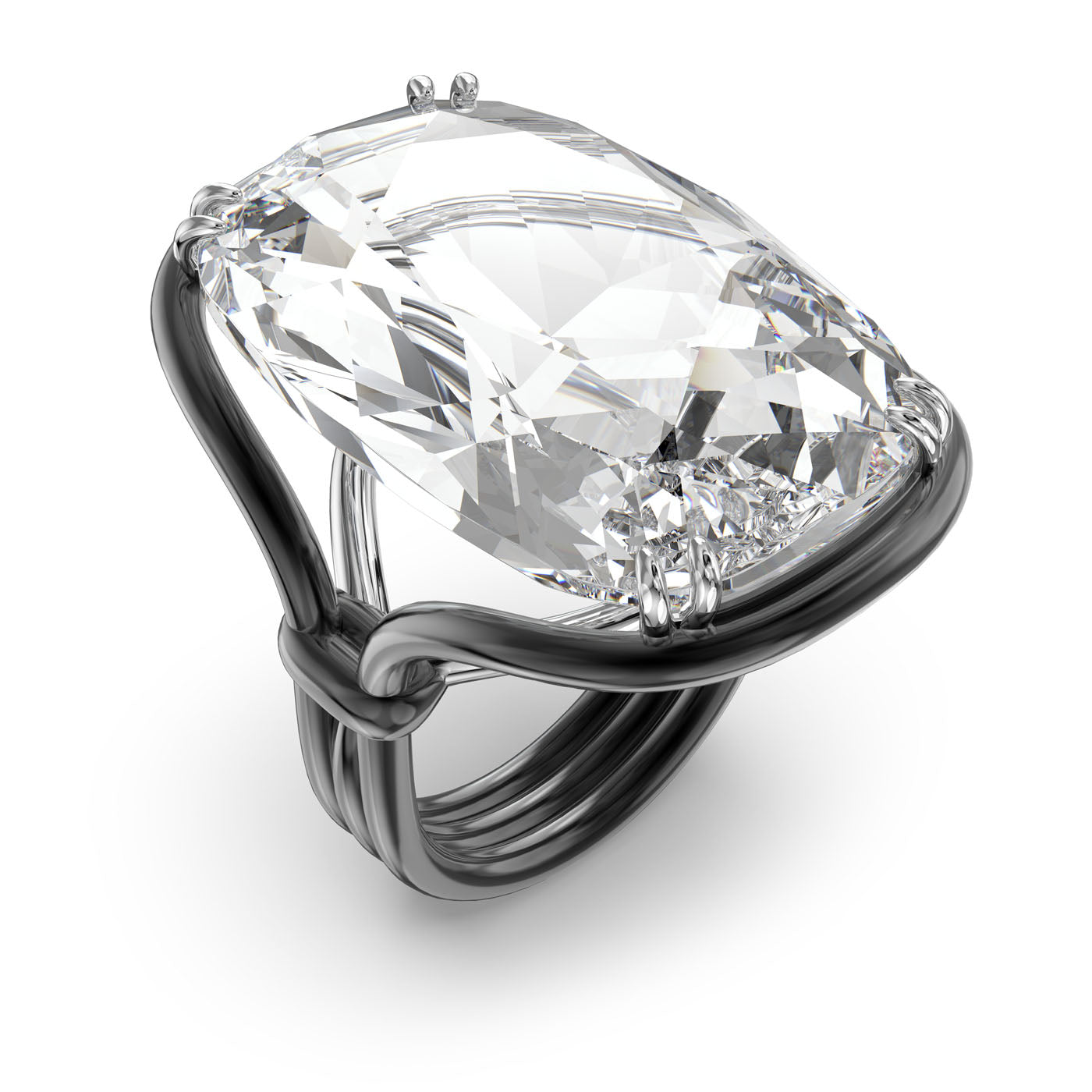 A close-up of the Swarovski Oversized Crystal Harmonia Cocktail Ring reveals its elegant design, featuring an oversized cushion cut crystal set in a polished, intricate silver band. The creation by Swarovski ensures the crystal remains the focal point, reflecting light beautifully and showcasing its brilliance against the sleek metal.