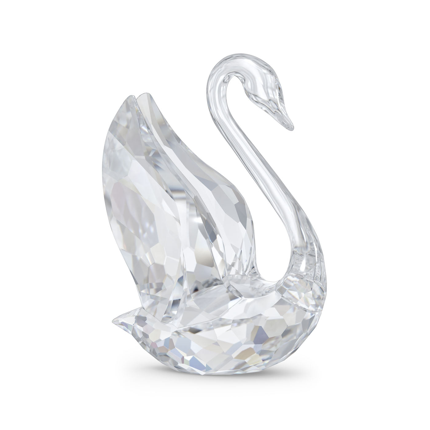 The Swarovski Medium Signum Swan Crystal Home Décor piece, designed by Swarovski, features a faceted pattern that beautifully captures and reflects light from different angles. This elegant decorative item is gracefully posed with its neck curved, crafted from exquisite clear crystal.