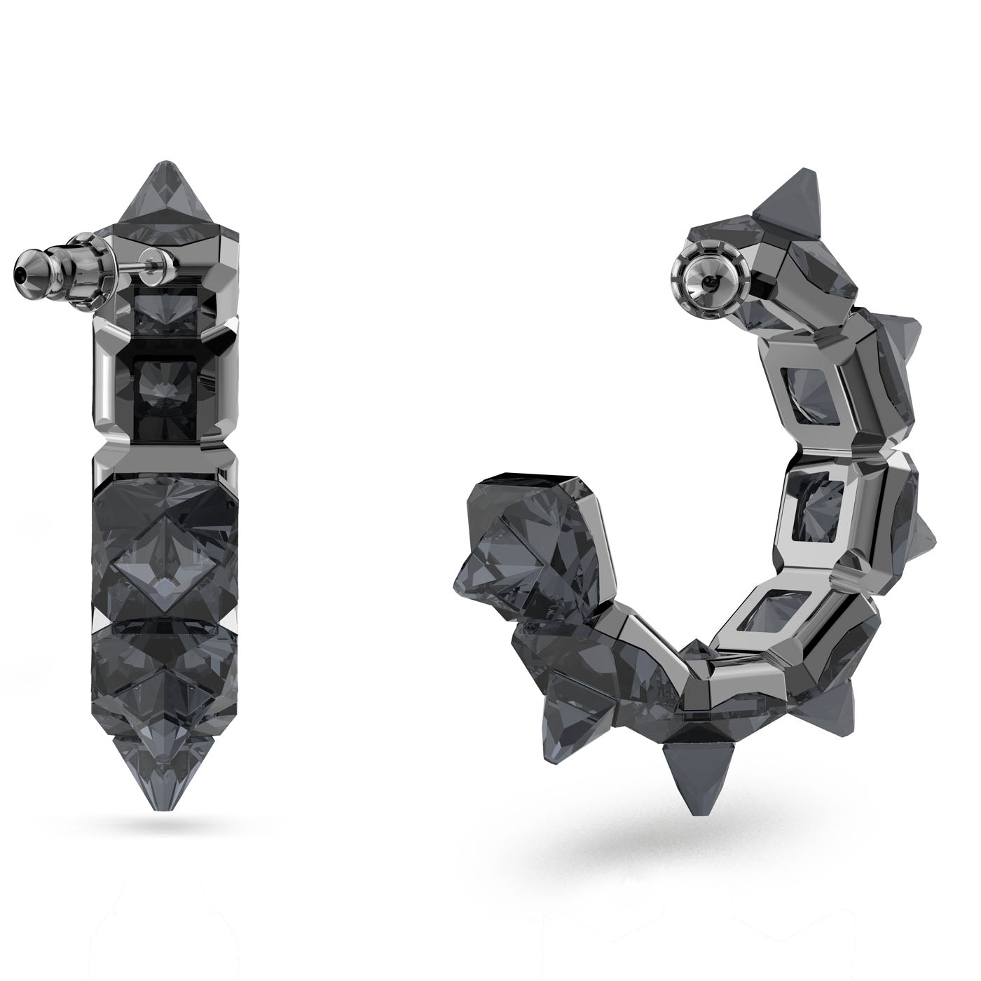 The Swarovski Pyramid Cut Crystal Ortyx Hoop Earrings from the Chroma family feature a sleek, dark finish. One earring presents a dagger-like design, and the other highlights a geometric statement with curved triangular spikes, exuding a modern allure.