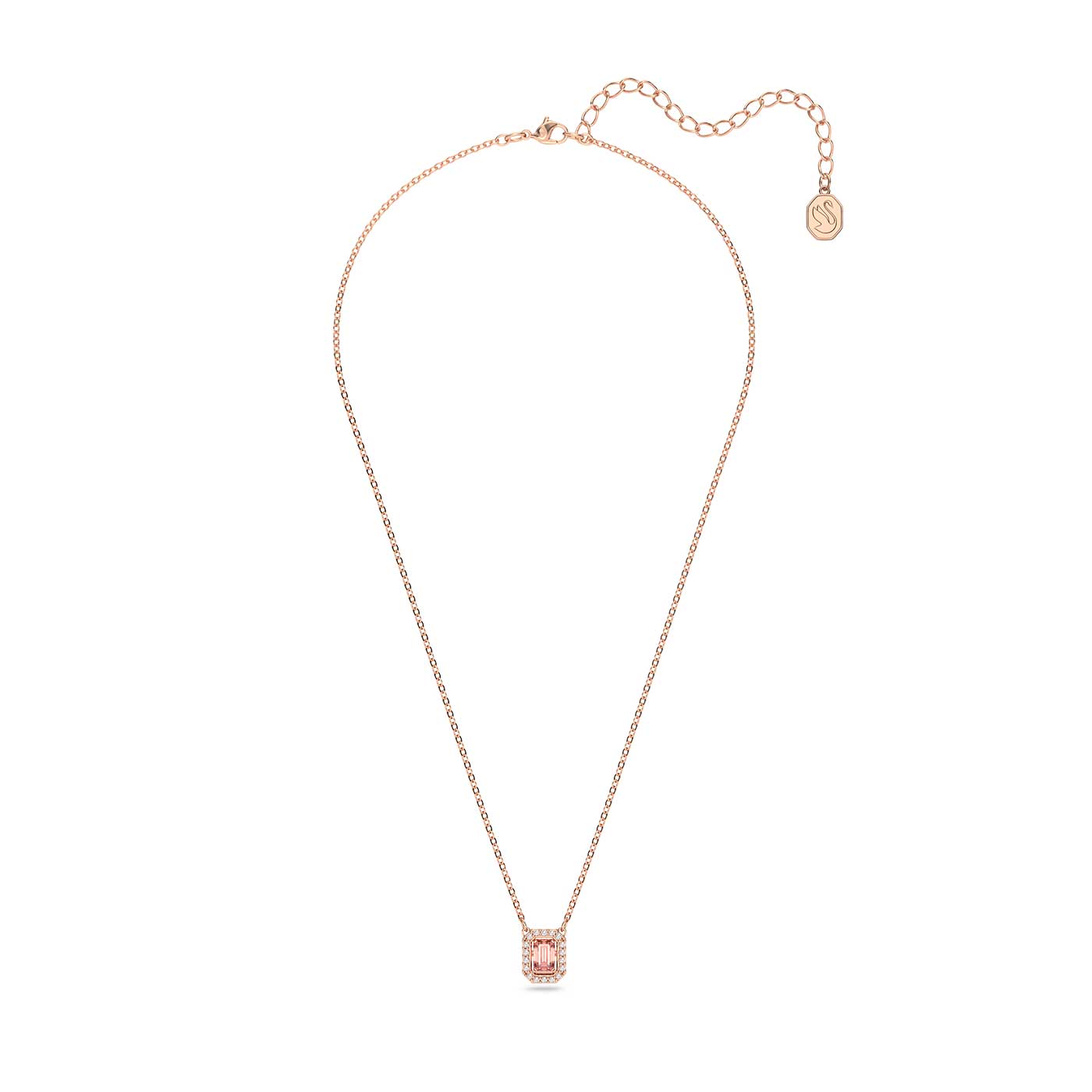 Introducing the Swarovski Millenia Zirconia Pink Octagon Cut Necklace, an elegant piece from the renowned brand Swarovski. This necklace boasts a rose gold-tone plated chain adorned with a dainty octagonal pendant, encrusted with sparkling zirconia stones. The adjustable chain gracefully ends with a gold tag, embodying both elegance and minimalist design.