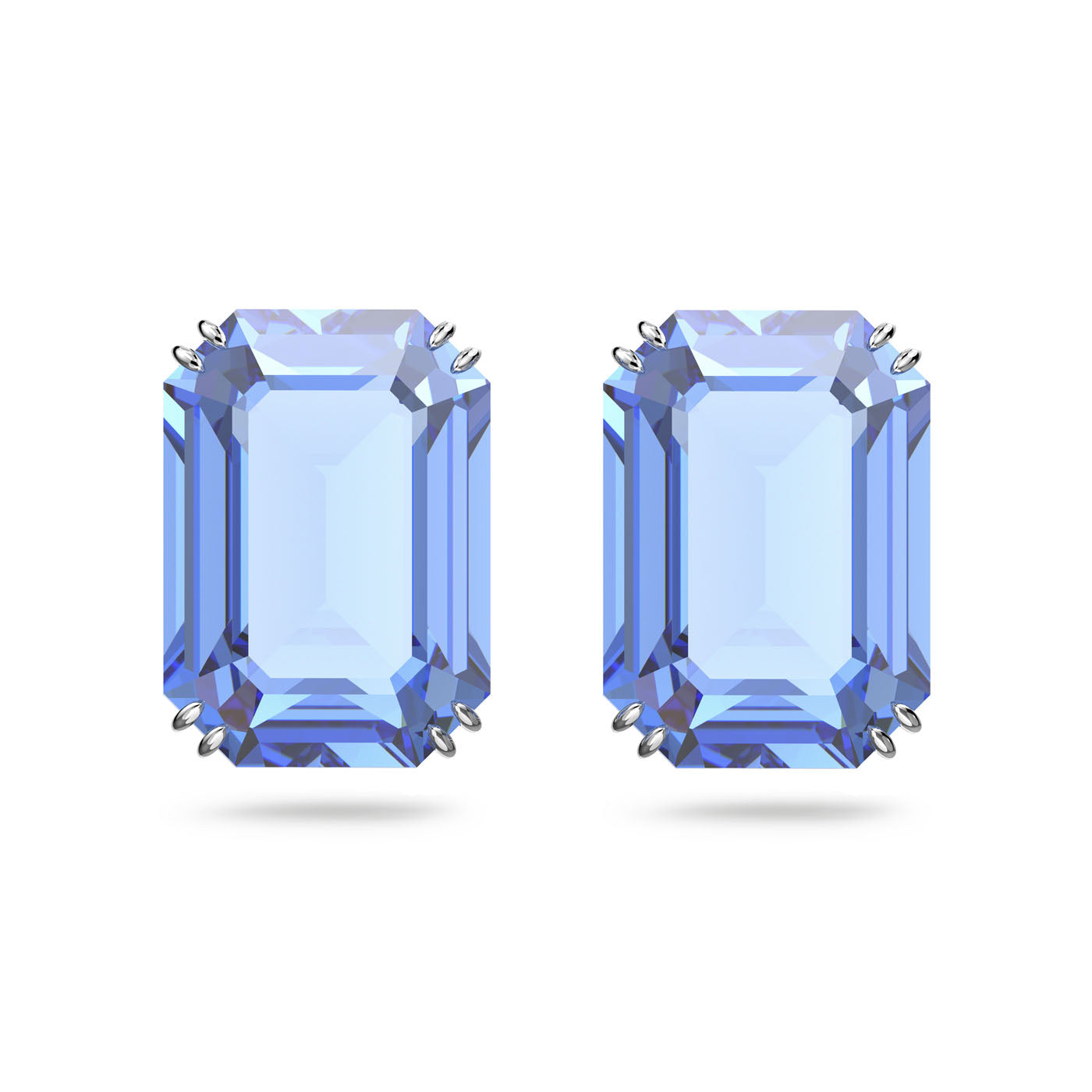 The Swarovski Millenia Octagon Cut Stud Earrings feature a pair of octagon-cut stones, set in a simple claw setting and showcased against a plain white background. The vibrant blue stones boast clear color with beautifully reflective facets.
