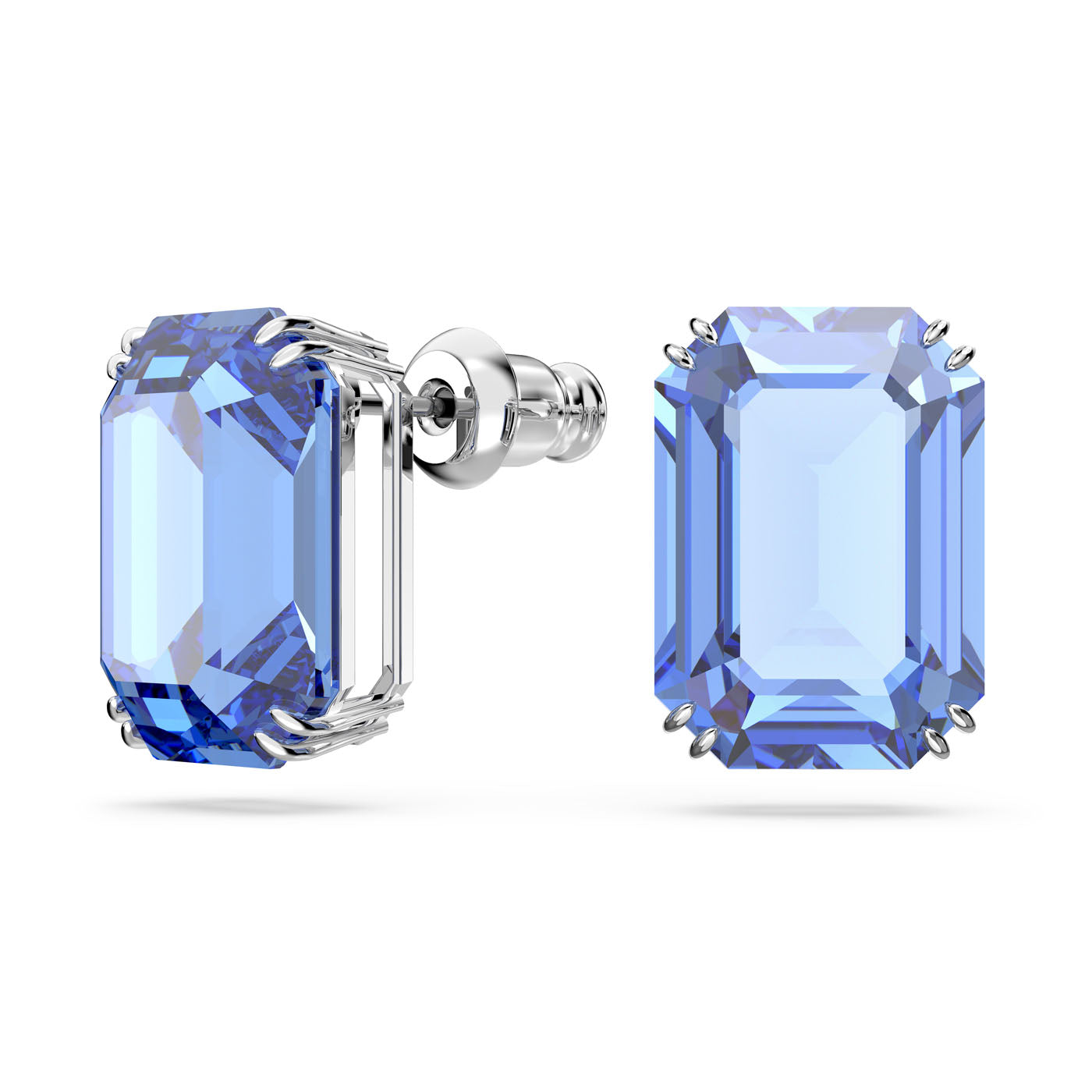 Close-up of the Swarovski Millenia Octagon Cut Stud Earrings, showcasing large, emerald-cut blue gemstones set in a sleek rhodium-plated setting. The stones display a vivid blue hue with facets that emphasize their clarity and brilliance. These elegant earrings by Swarovski are designed with secure backings.