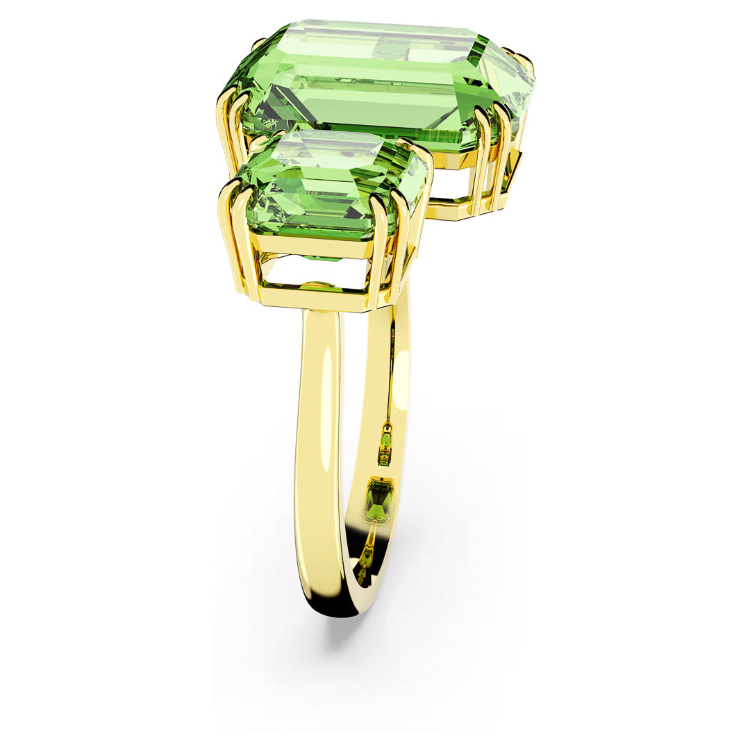 The Swarovski Millenia Open Ring showcases two large, emerald-cut green gemstones in prong settings. Its sleek and polished design, combined with a modern style, makes it a standout piece perfect for any occasion.