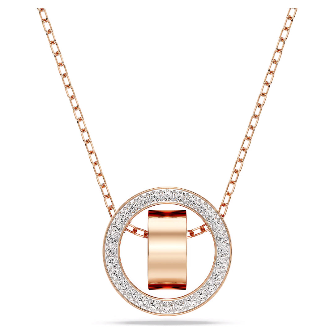 The Swarovski Dextera Necklace Pendant, crafted by Swarovski, showcases exceptional artistry with a circular pendant. Its polished center is encircled by an outer ring adorned with dazzling crystal pavé. The delicate chain harmoniously complements the luxurious rose gold tone of the pendant.