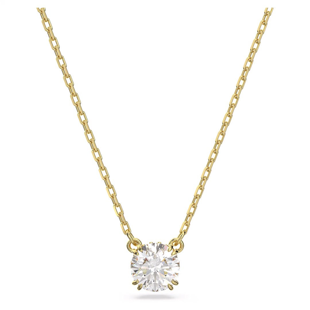 Discover the Swarovski Stilla Necklace Pendant, a chain necklace plated in gold-tone featuring a central round-cut zirconia. The minimalist design with four prongs highlights the gemstone's brilliance, offering a simple yet elegant style.